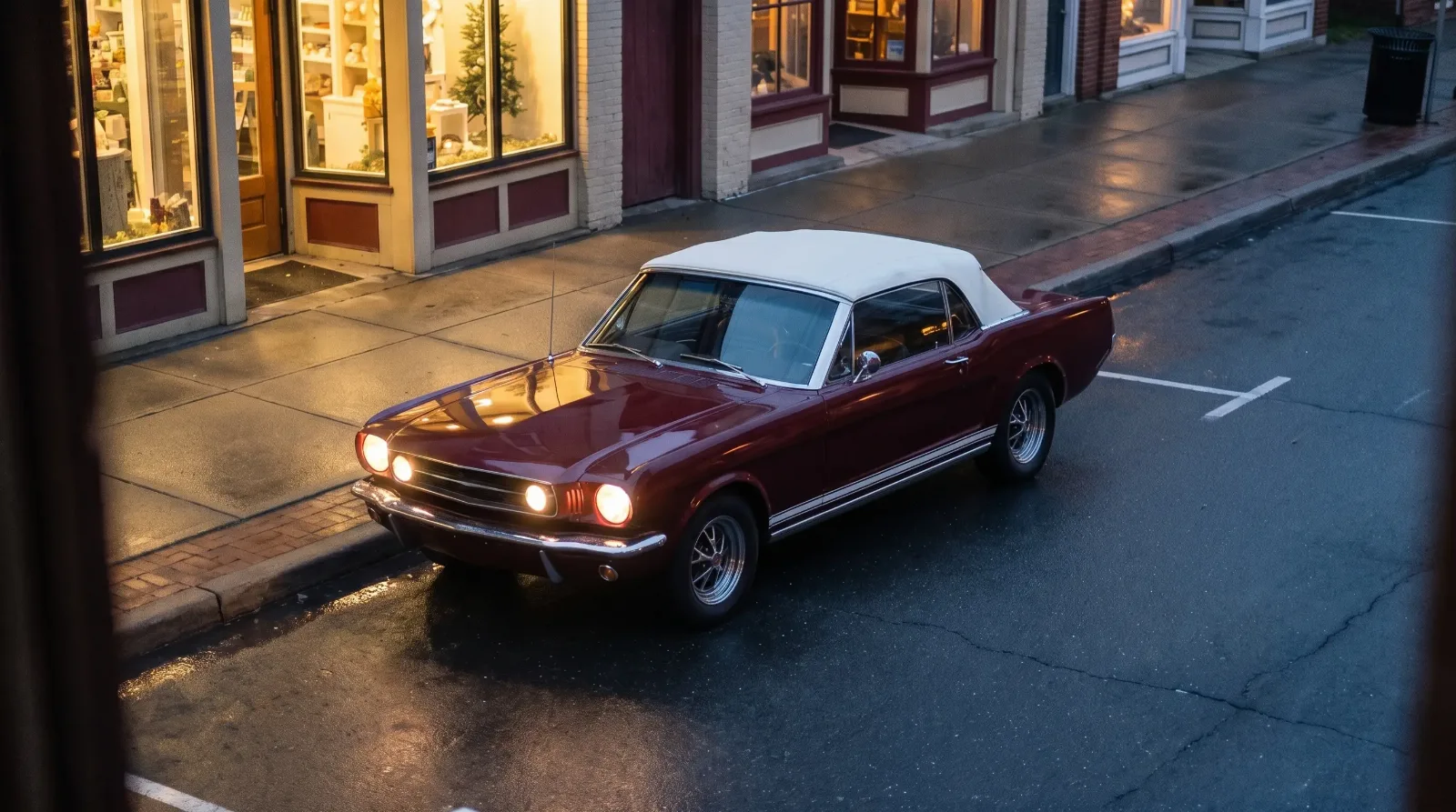 1965 Ford Mustang GT convertible, fog lamps lit on Main Street at dusk