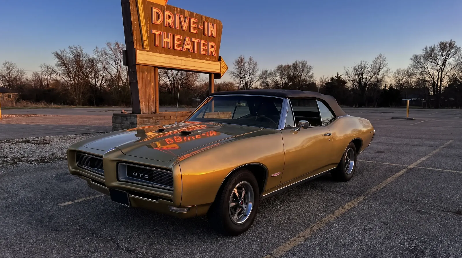 1968 GTO convertible at dusk drive-in