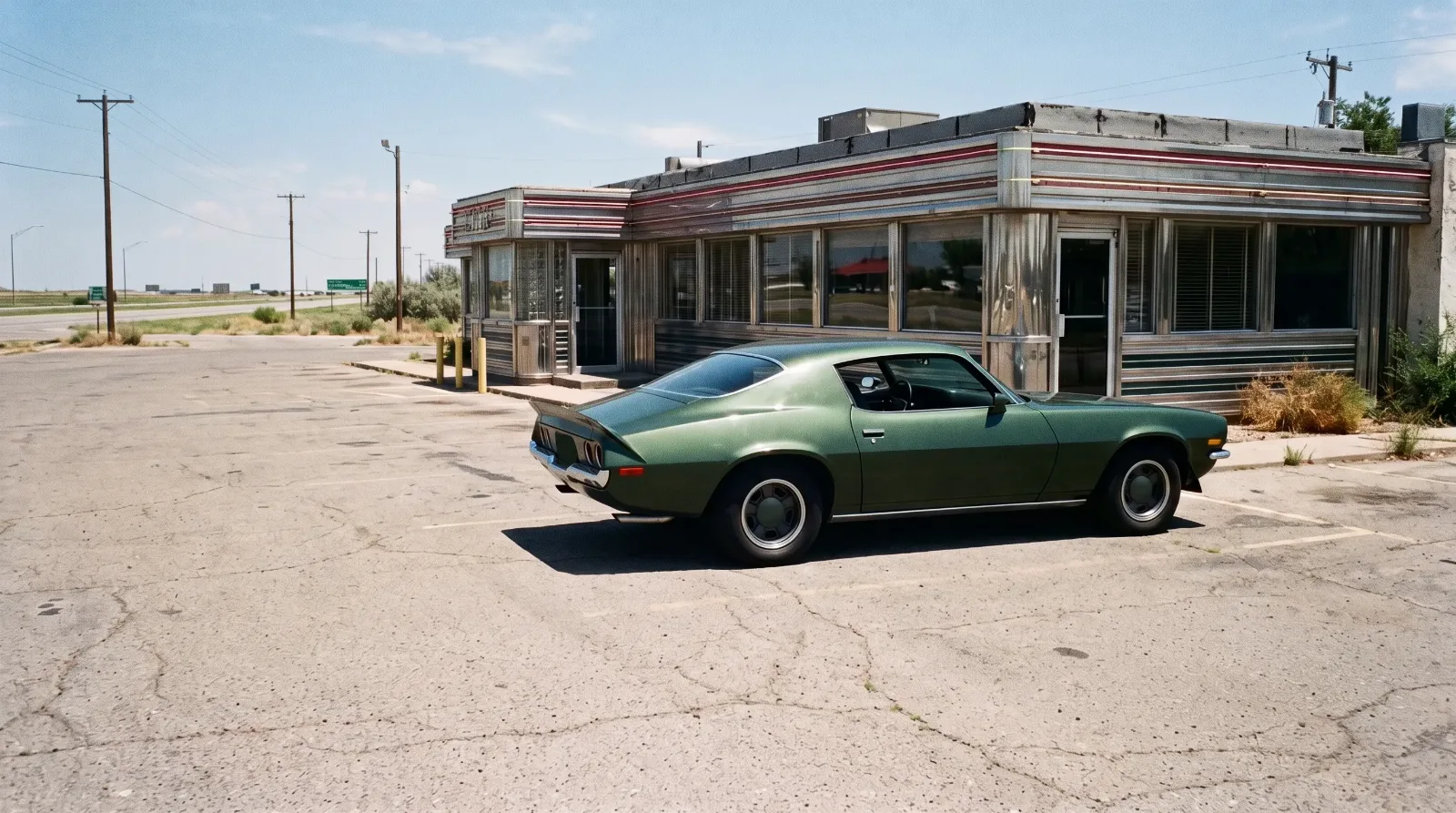 1970 Chevrolet Camaro, long hood and short tail outside a diner