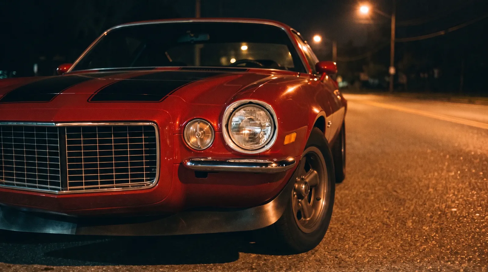 1970 Chevrolet Camaro Z/28, under streetlights on an empty road