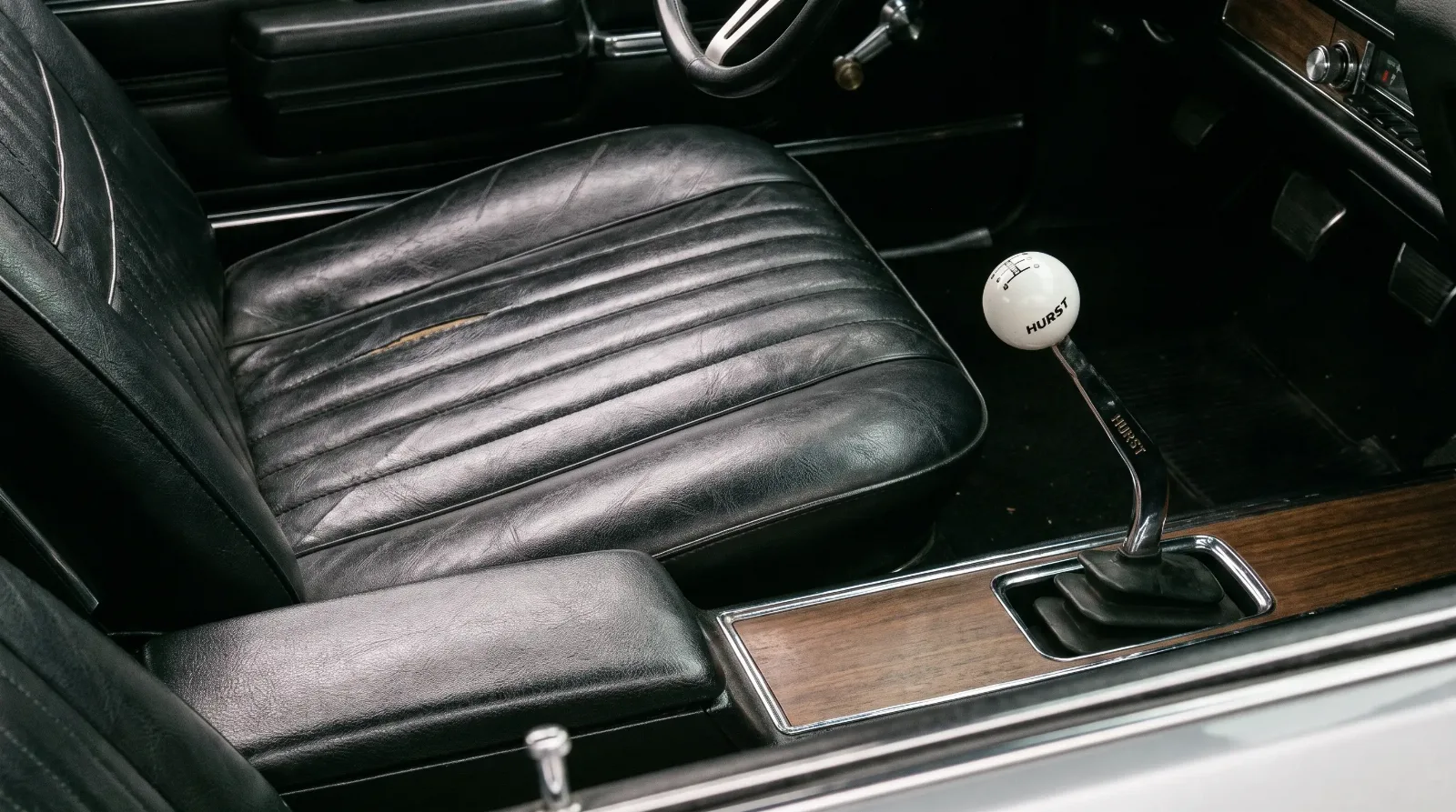 Strato bucket seat and Hurst shifter detail