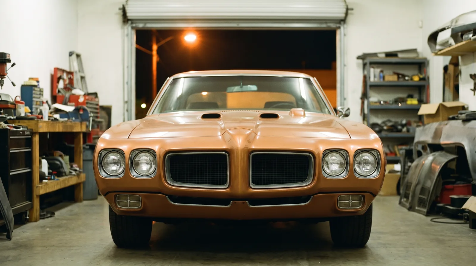 1970 Pontiac GTO: Ram Air hood scoops in a night workshop