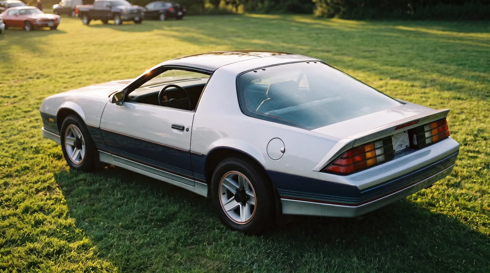 1982 Chevrolet Camaro Z28 Indy 500 Commemorative Edition, parked on a show lawn at sunset