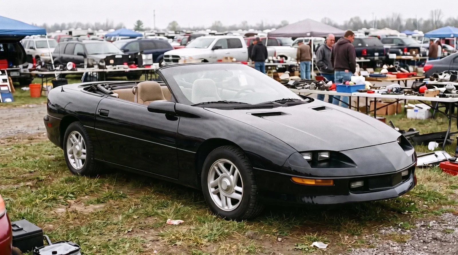 1994 Chevrolet Camaro convertible, top down at a swap meet