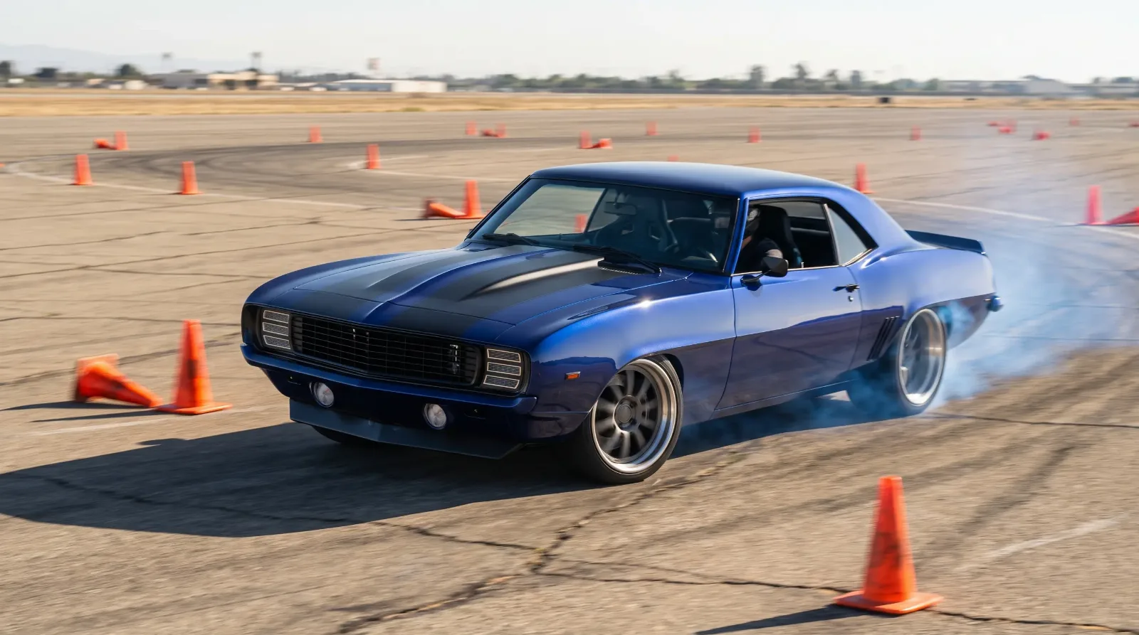 Pro touring 1969 Chevrolet Camaro cornering on autocross course
