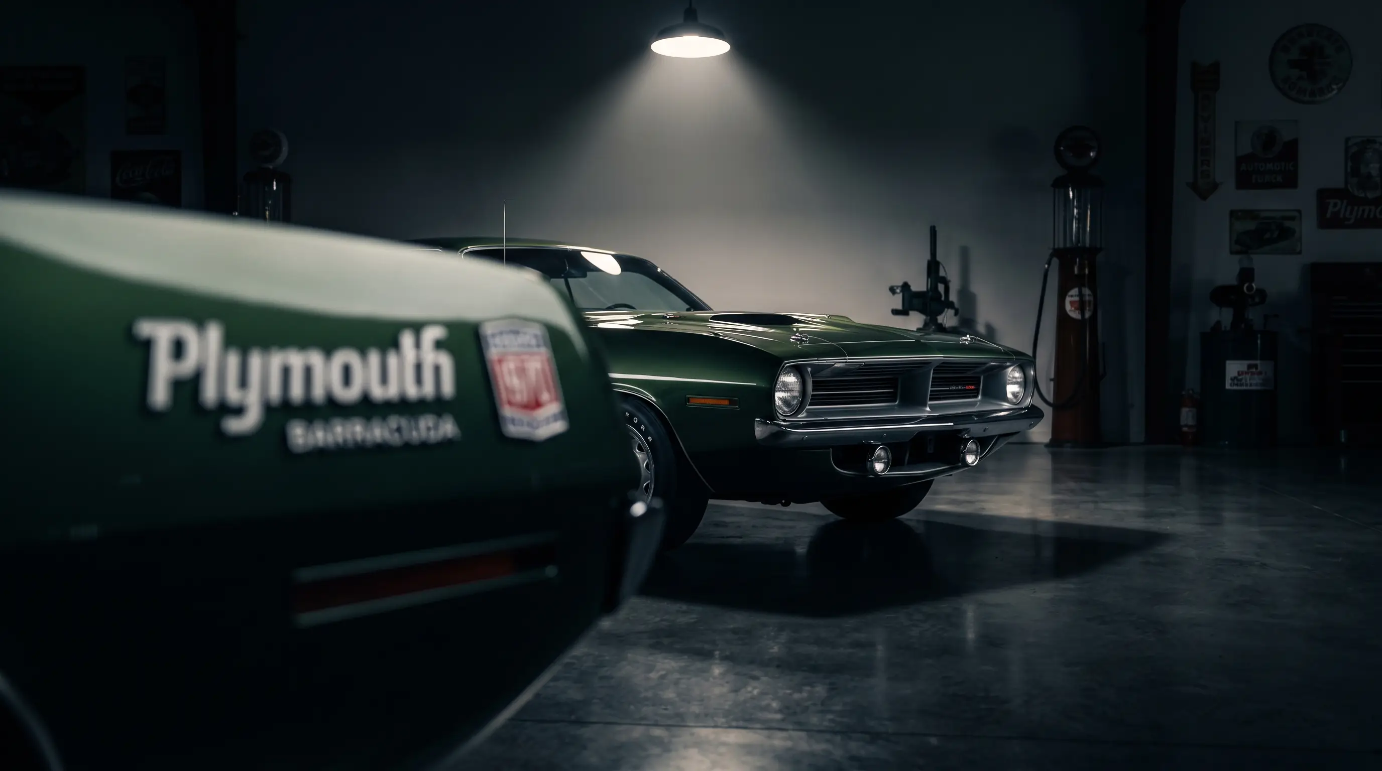 1970 Plymouth Barracuda under a dramatic spotlight in a concours garage