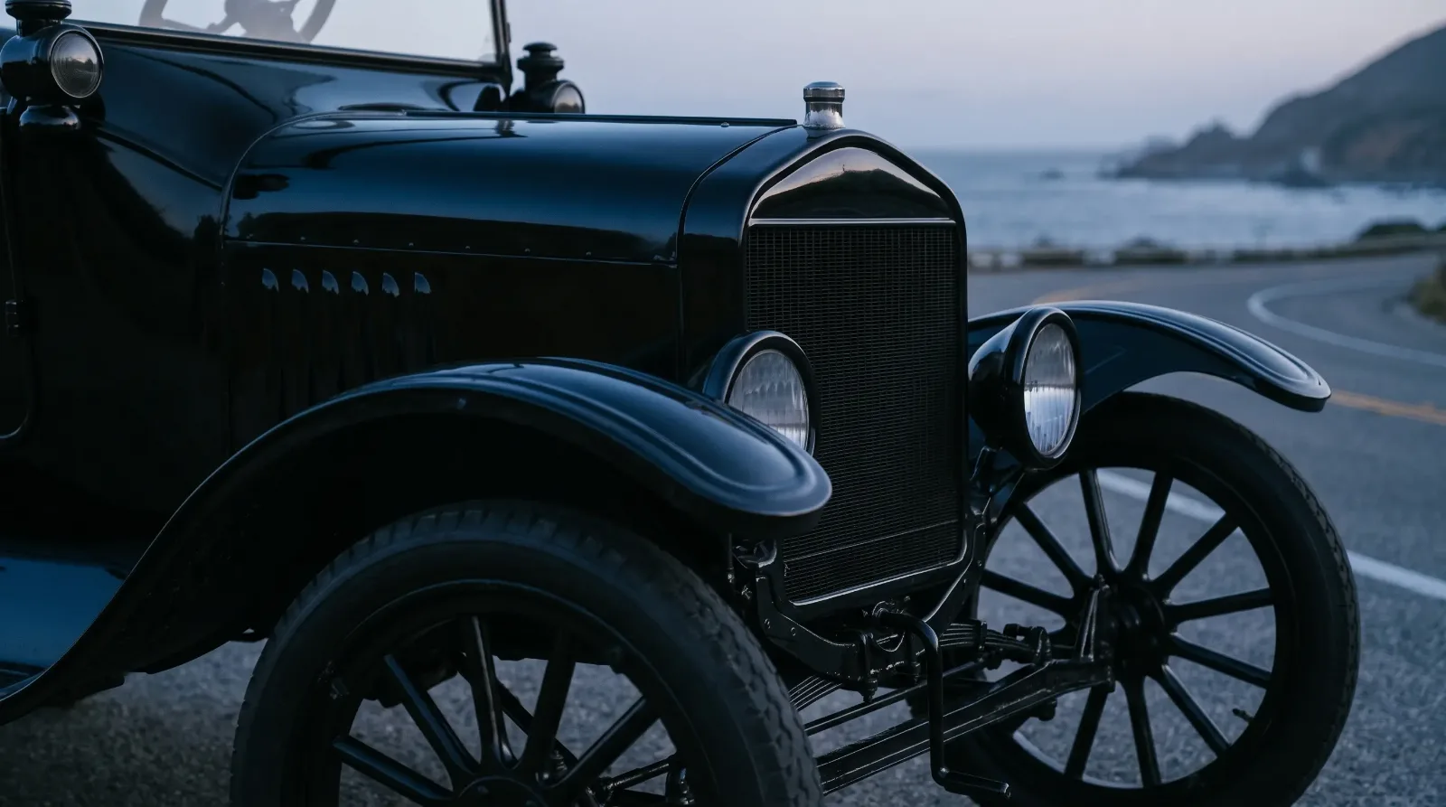 1918 Ford Model T touring, black radiator shell and crowned fender at dusk