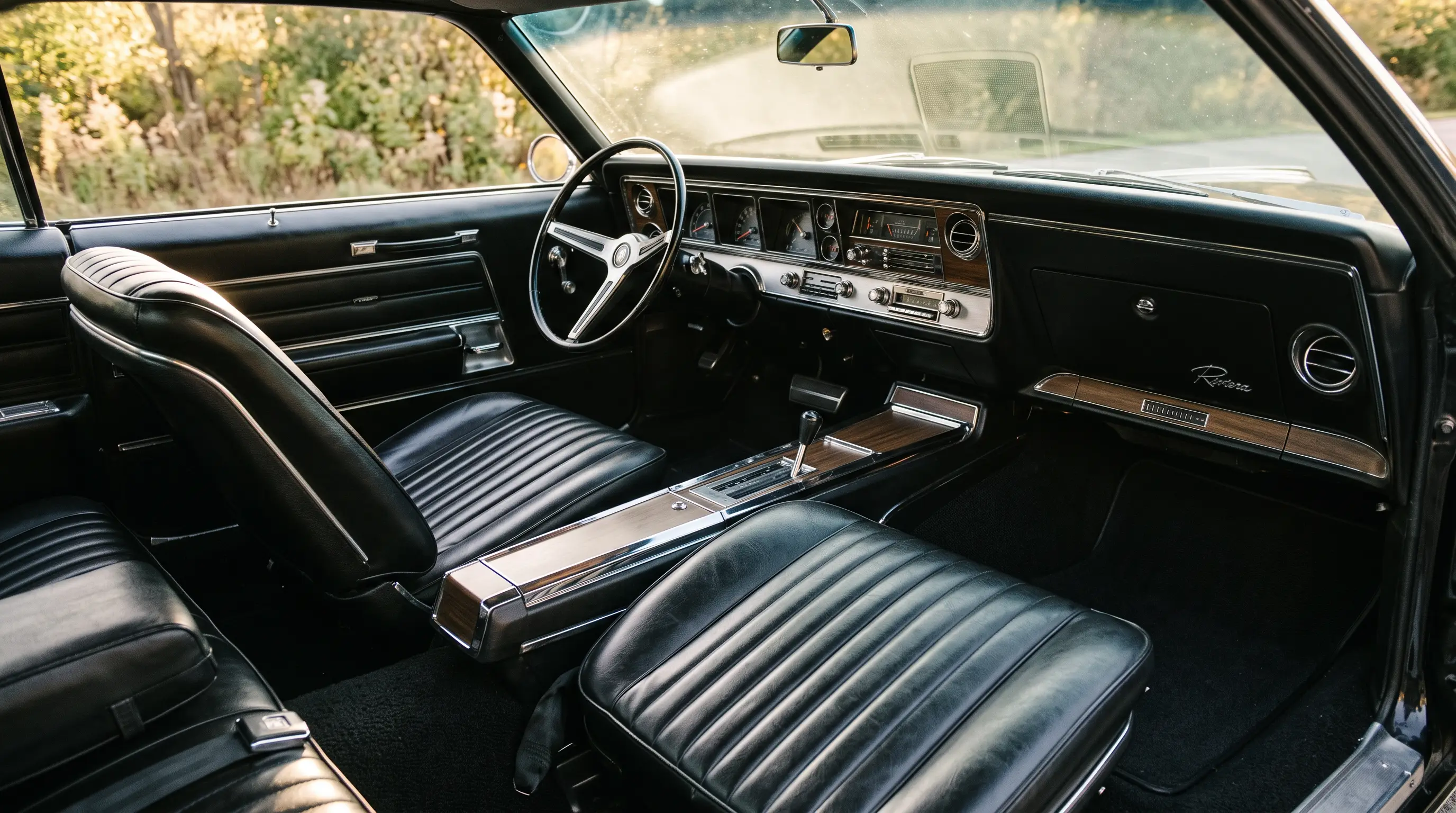 Interior of a 1966 Buick Riviera with wide bucket seats and full width dashboard