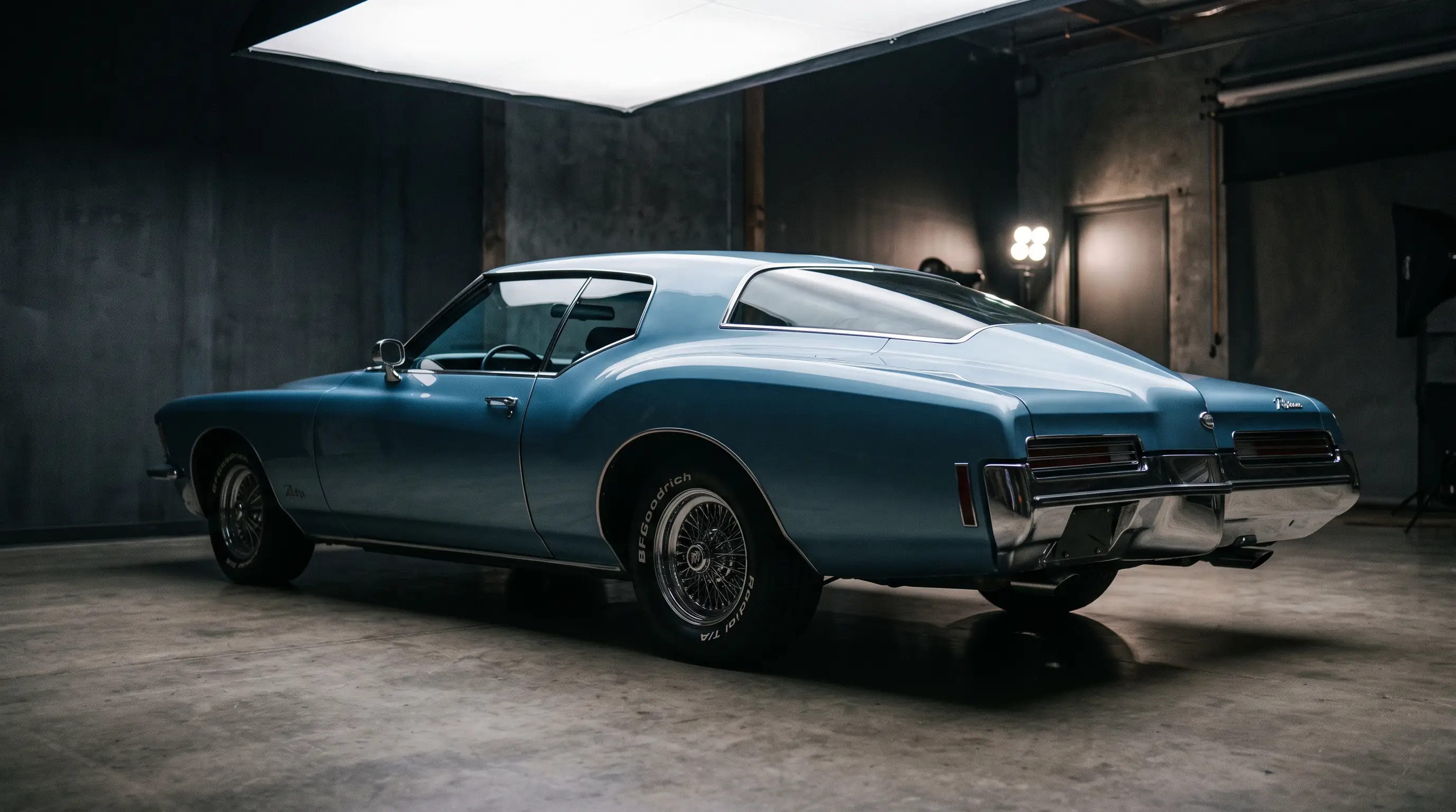 1971 Buick Riviera boat tail rear three quarter view in moody studio light
