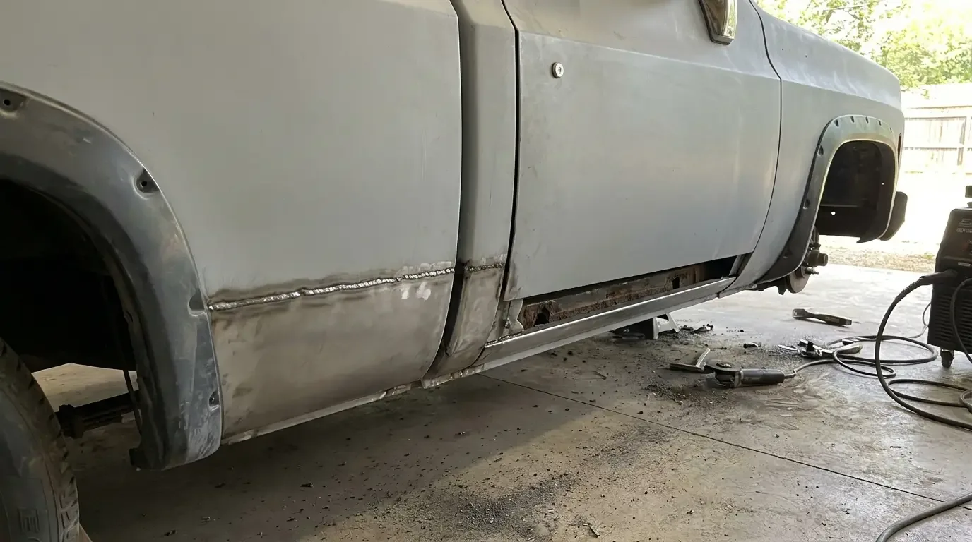 1978 Chevrolet C10 cab corner -- new rocker panel patch and weld