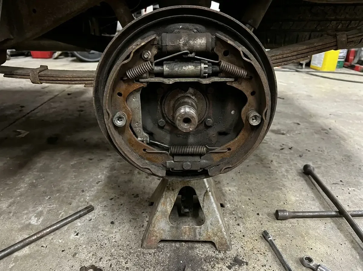 1970s Chevrolet C10 rear drum brake exposed -- shoes and star wheel adjuster