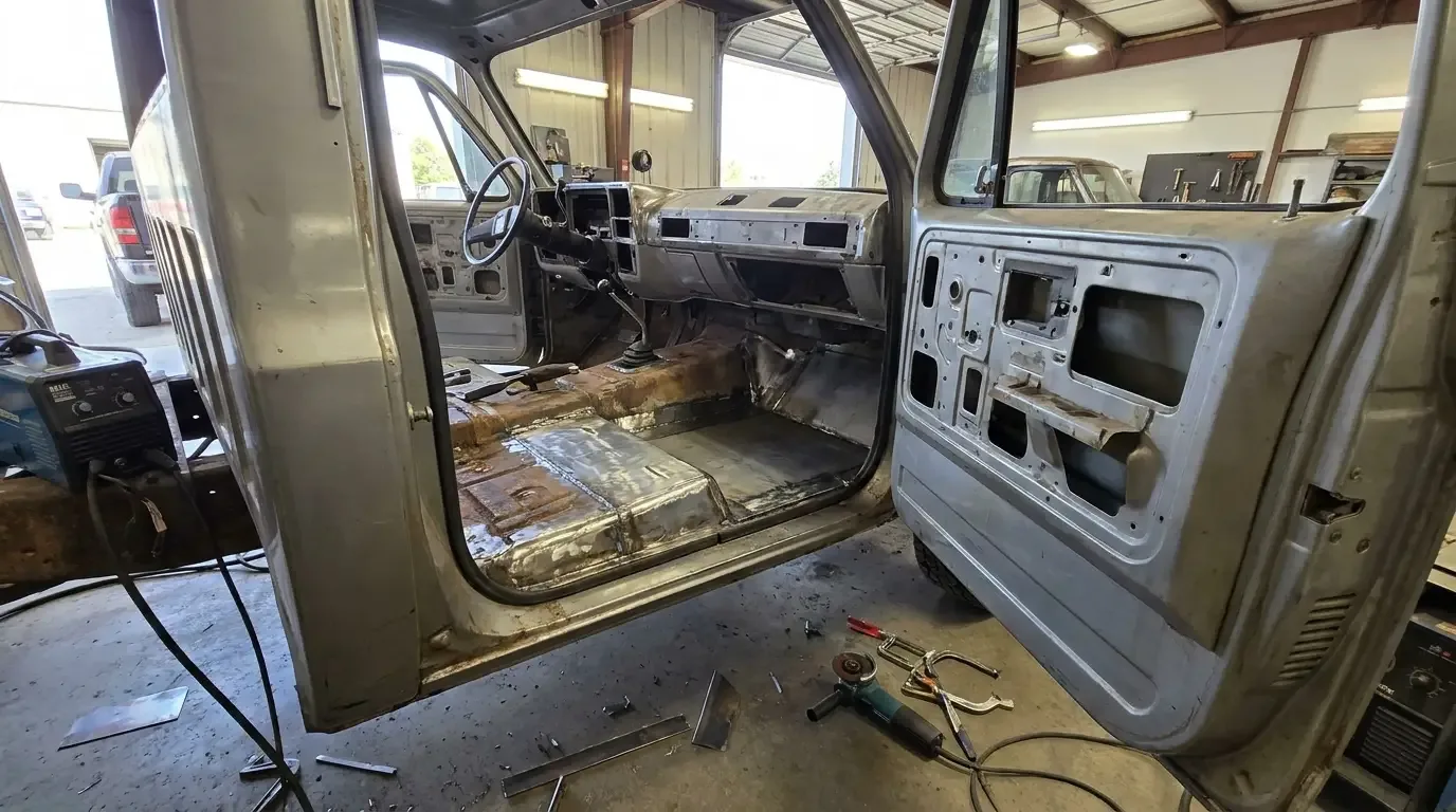 1975 Chevrolet C10 floor pan -- fresh weld repair in workshop
