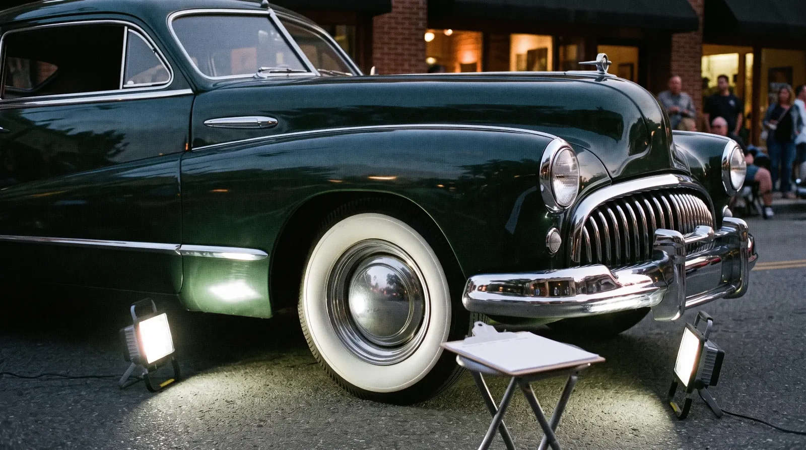 Evening car show judging on a city street with a 1948 Buick Roadmaster