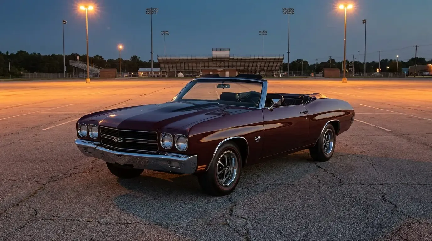 Burgundy 1970 Chevrolet Chevelle SS convertible parked in a stadium parking lot at dusk