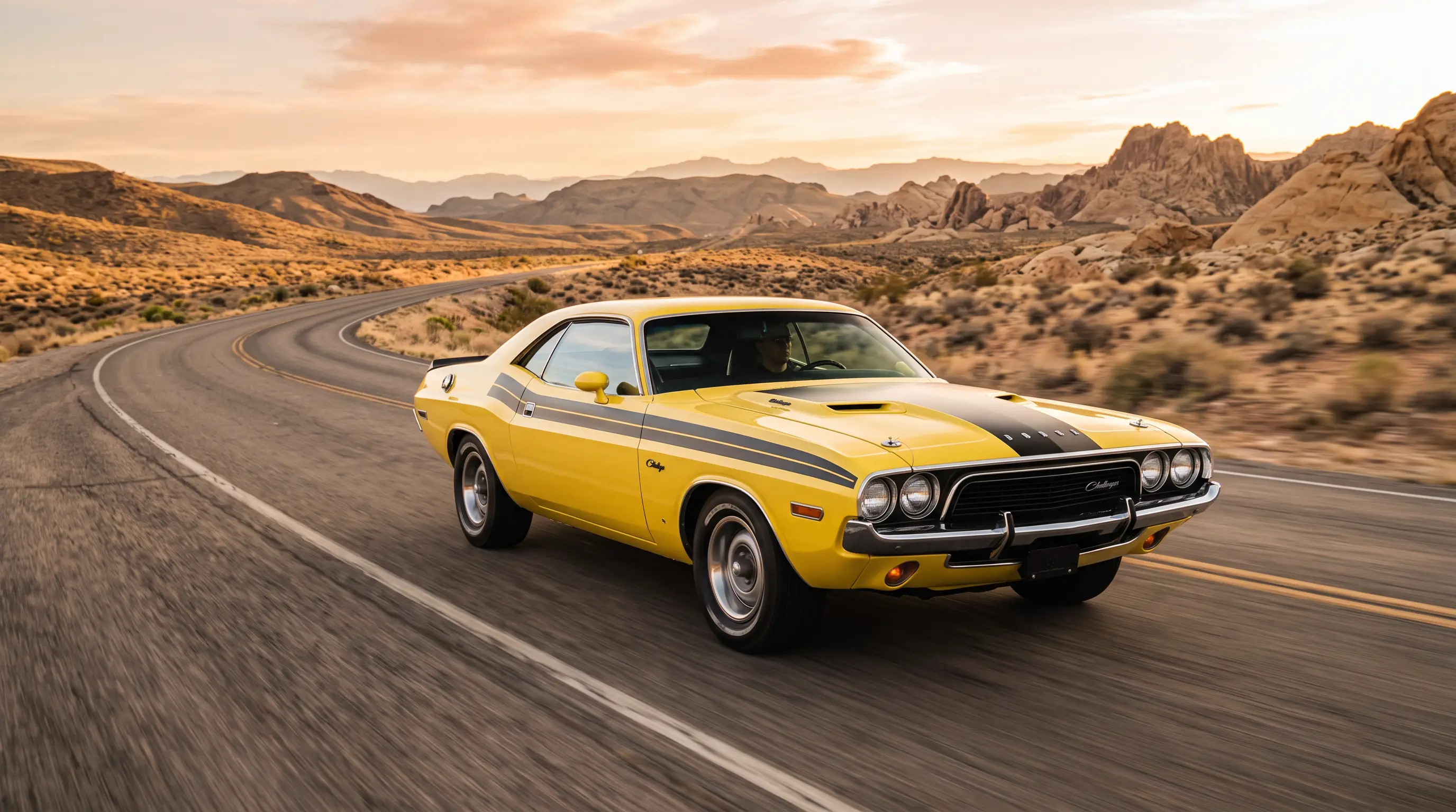 Yellow 1972 Dodge Challenger Rallye with black stripe on a desert highway at golden hour