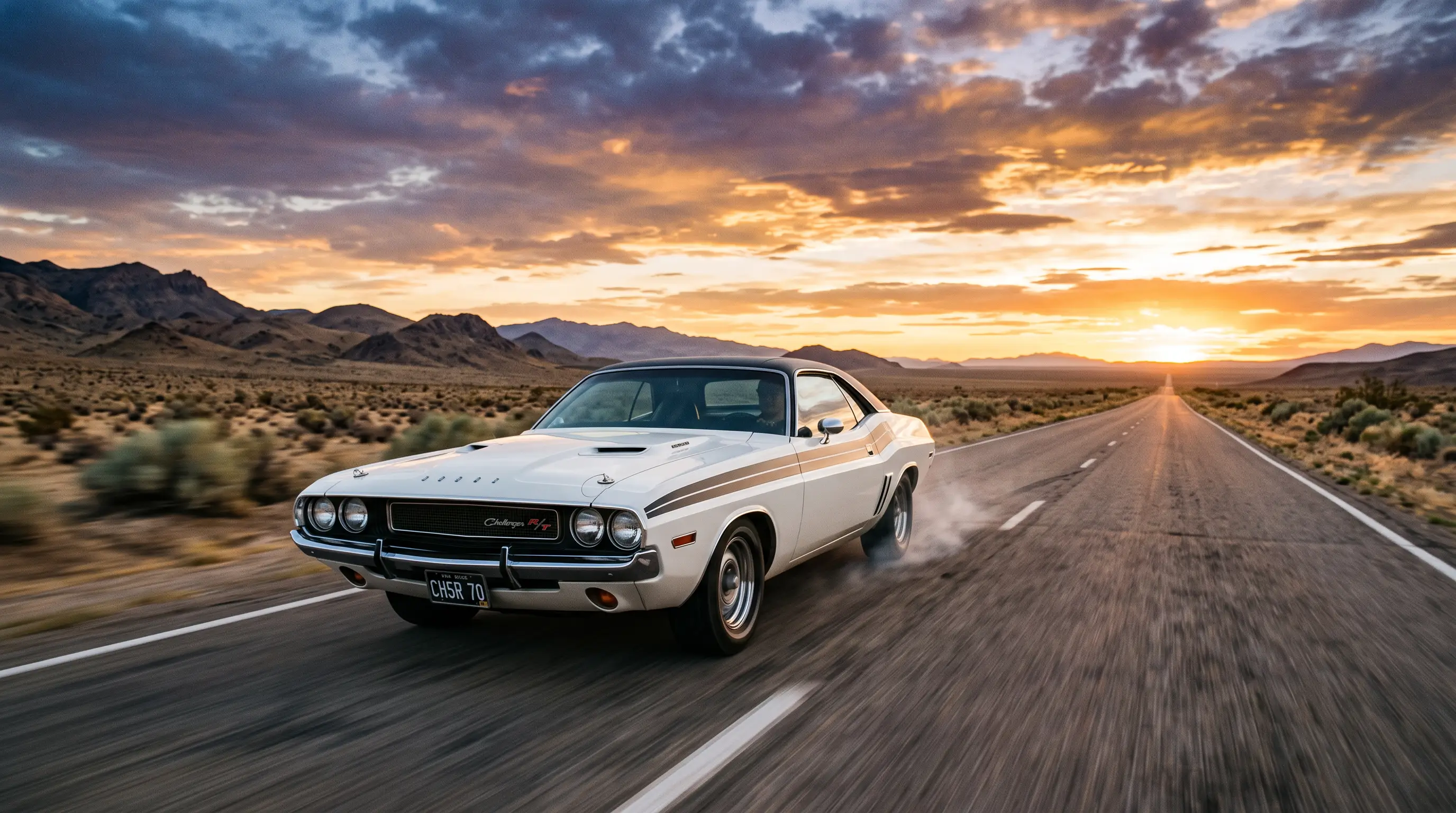 White 1970 Dodge Challenger on a lonely desert highway at sunset