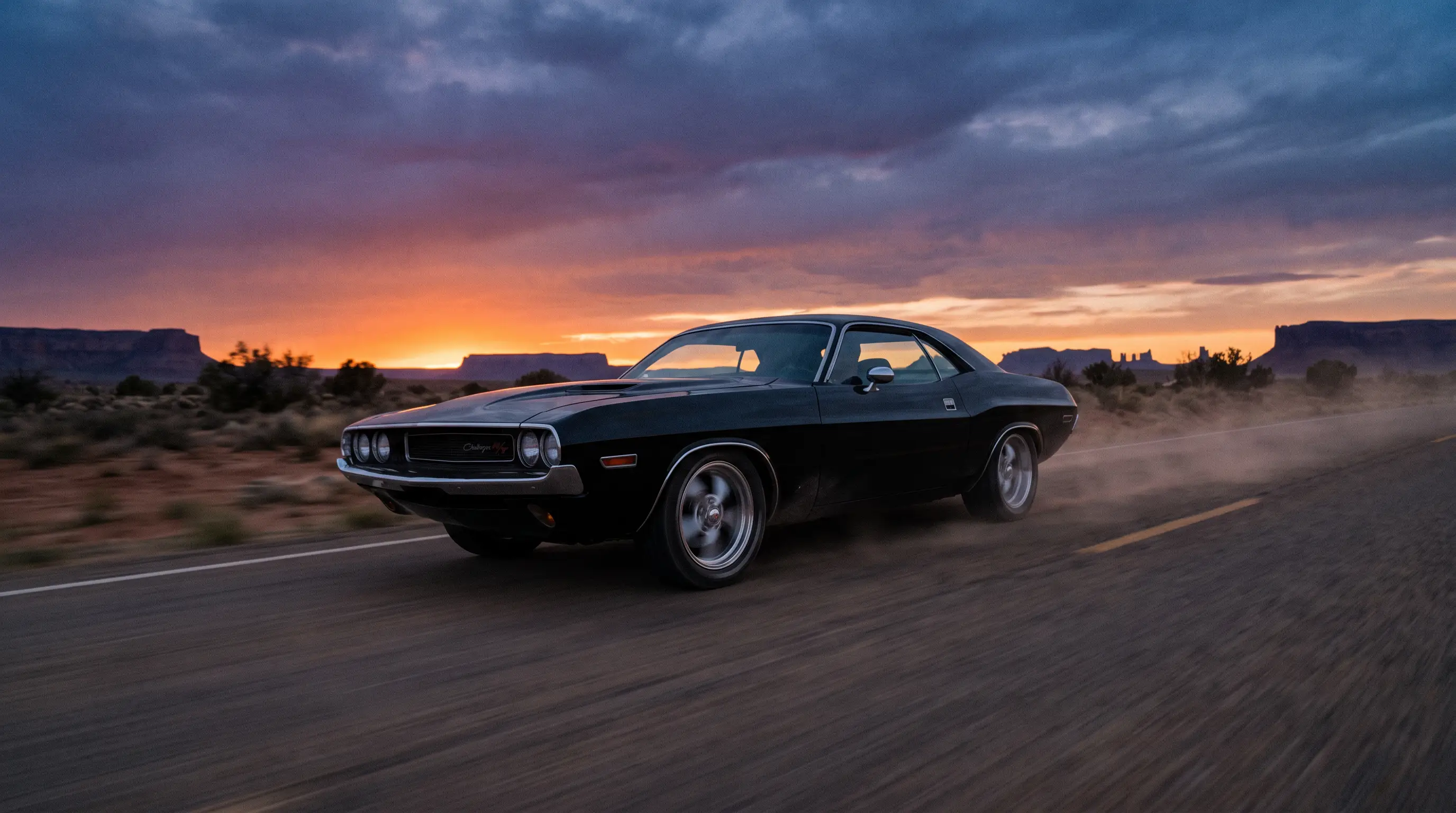 Black 1970 Dodge Challenger R/T racing down a lonely desert highway at dusk