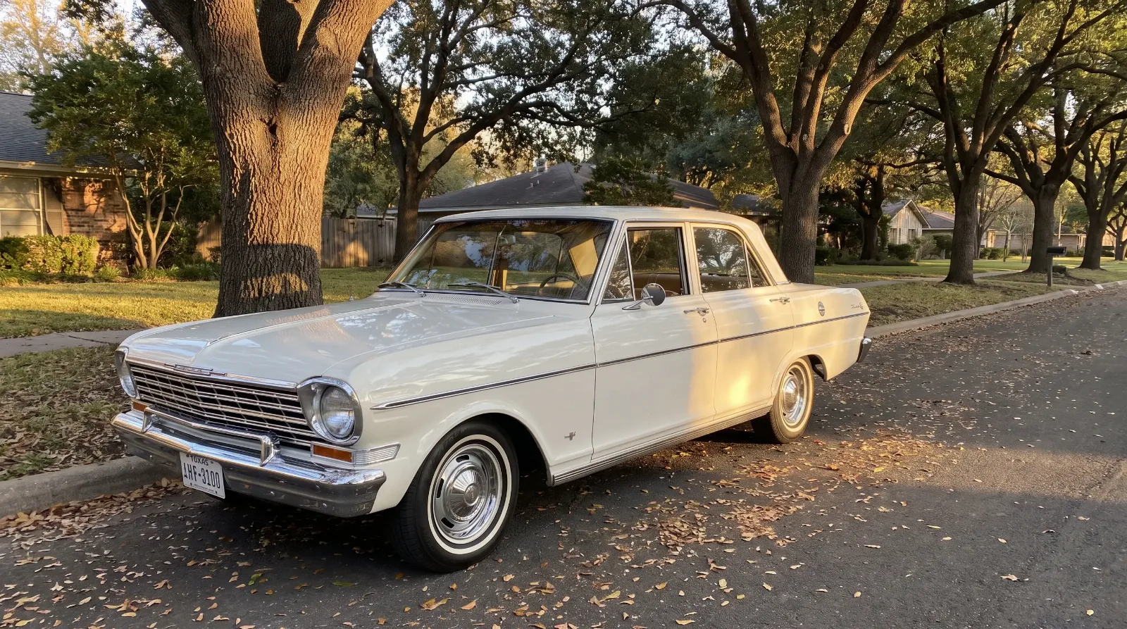 1963 Chevrolet Chevy II Nova 400 sedan parked on a tree-lined suburban street