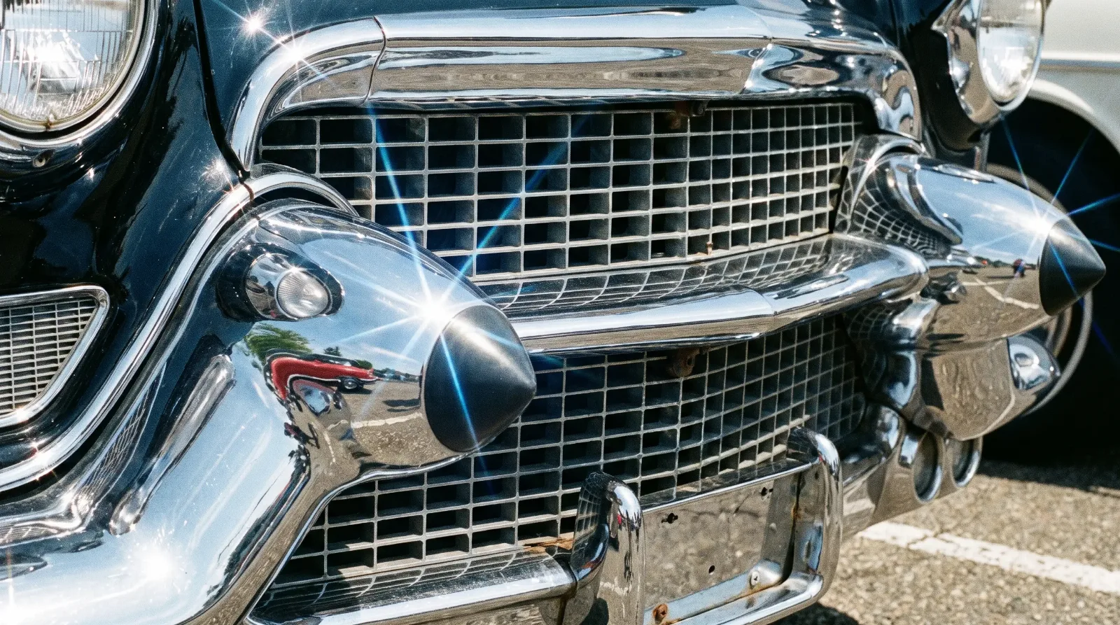 1958 Cadillac Eldorado — chrome eggcrate grille and dagmar bumper detail
