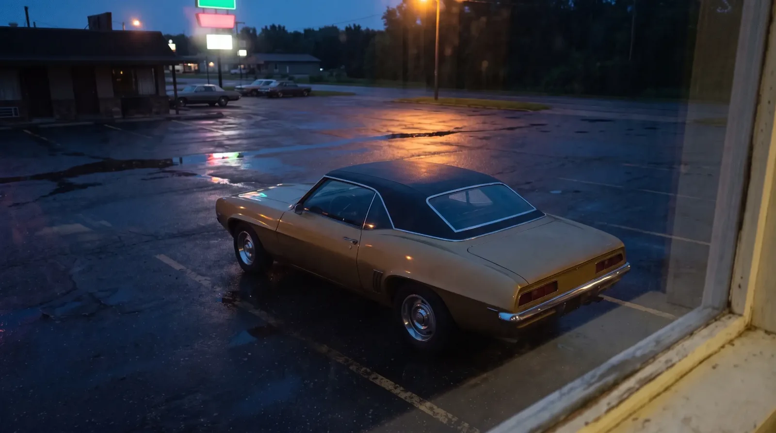 1969 Chevrolet Camaro coupe in a roadside lot at dusk