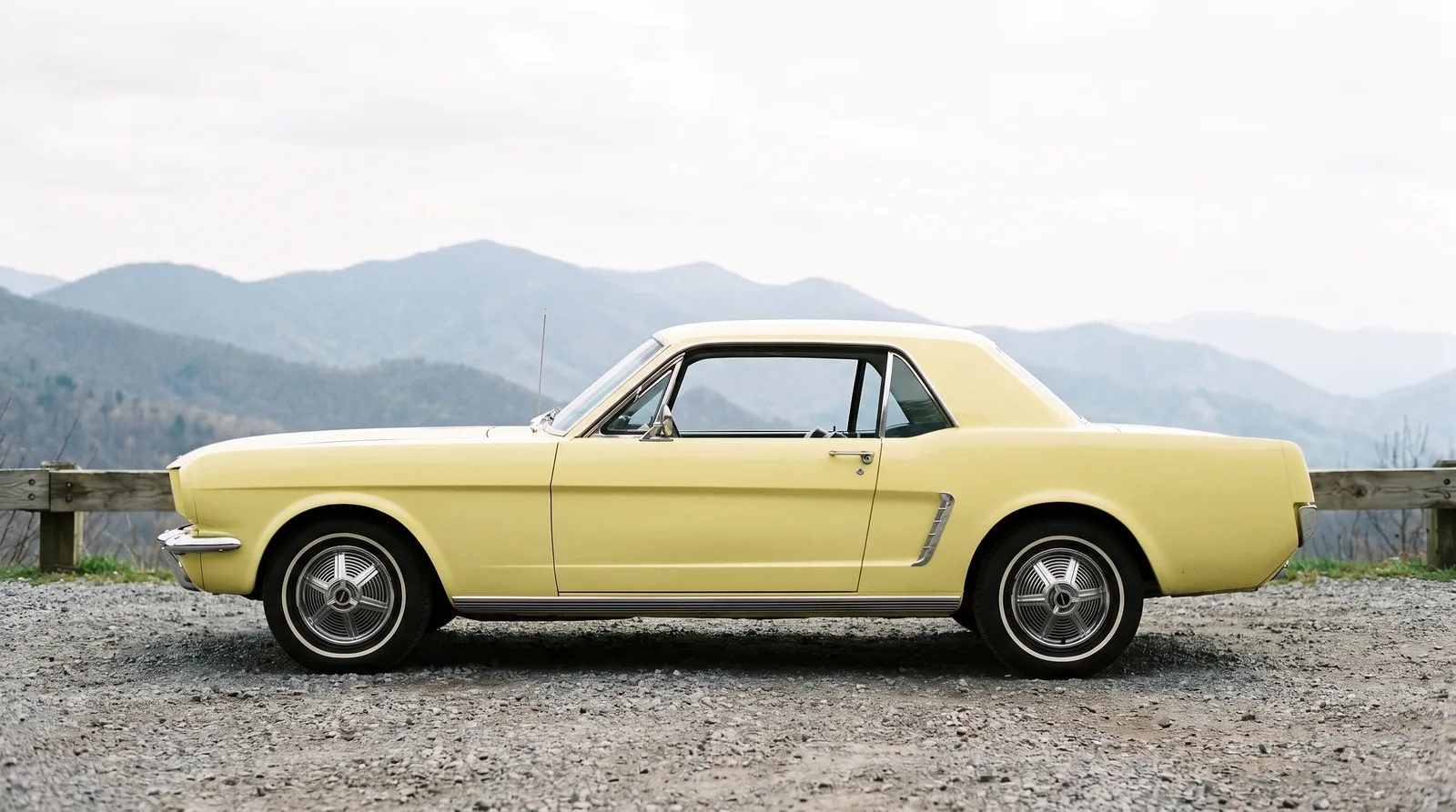 1965 Ford Mustang hardtop, side profile on mountain pass