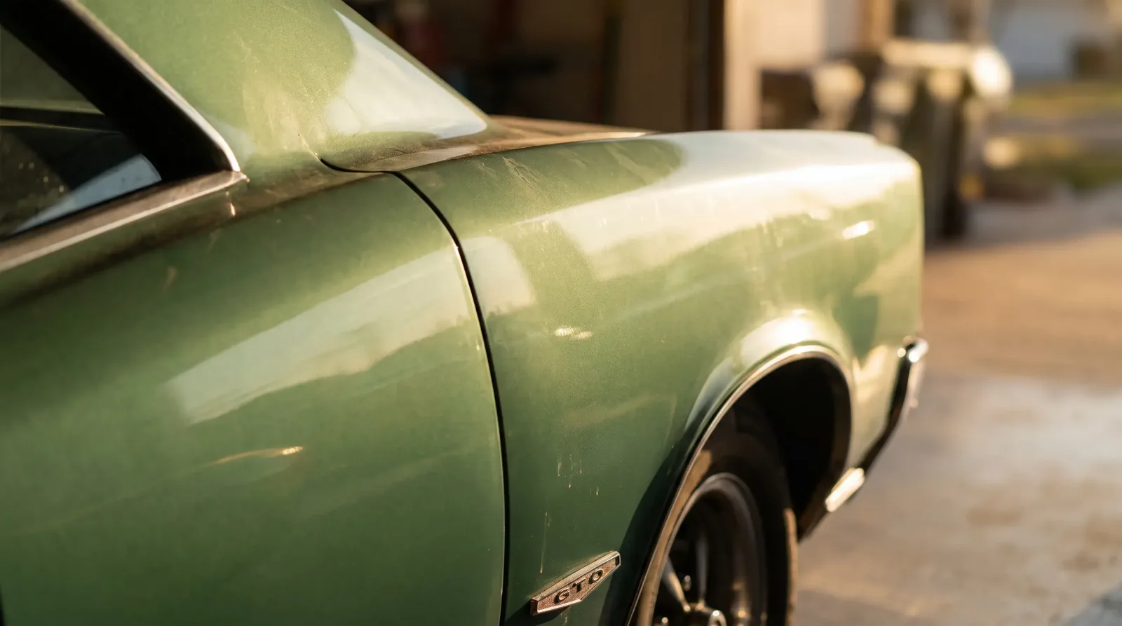 Sunlight on GTO Coke-bottle rear fender curve