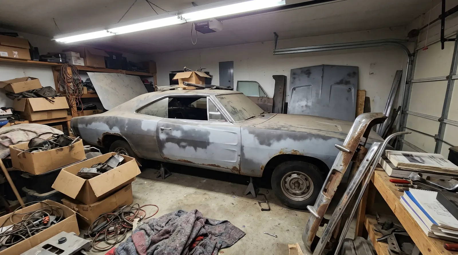 Stalled Dodge Charger restoration project in a cluttered garage