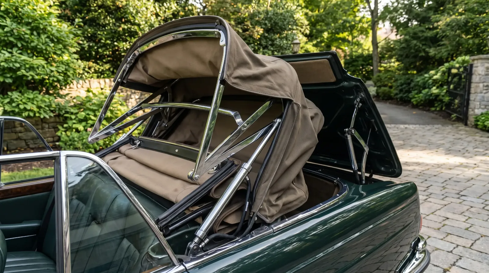 Folding convertible top frame and hydraulic mechanism