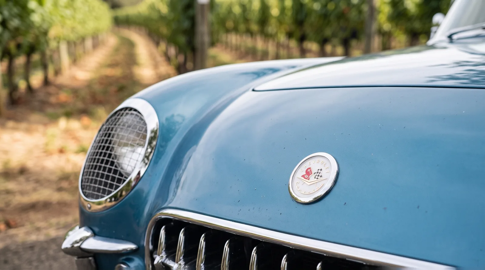 1954 Chevrolet Corvette nose emblem with crossed flags, vineyard lane
