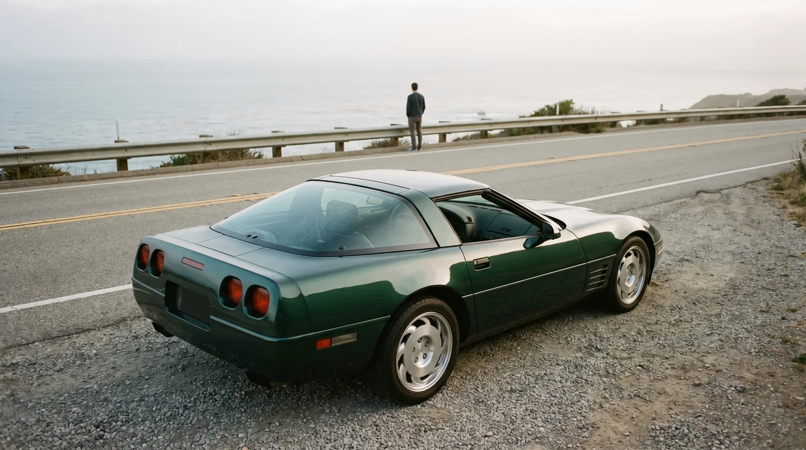 1991 Chevrolet Corvette ZR-1, parked above a foggy coastline