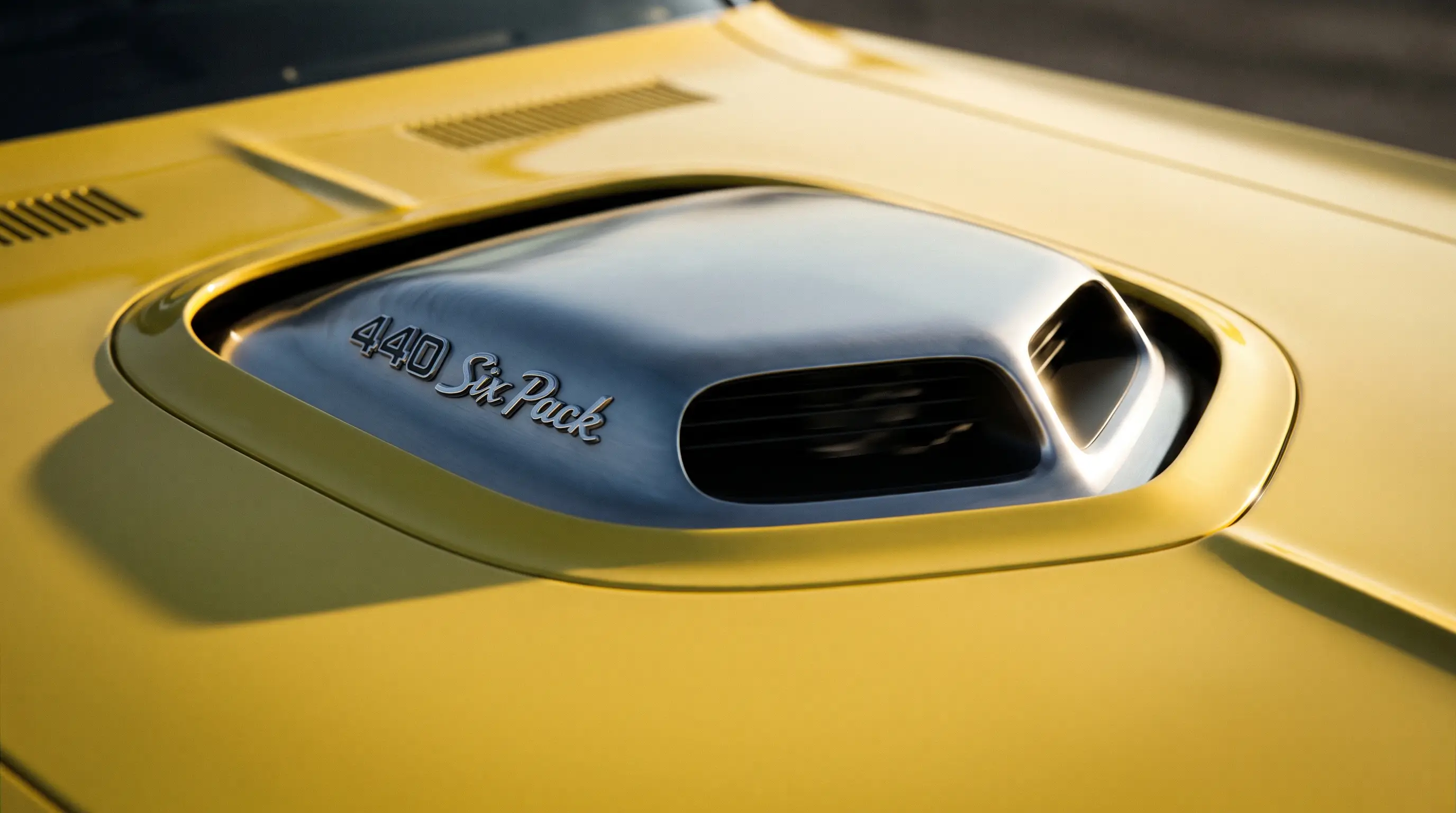 Close up of the Shaker hood scoop on a yellow 1970 Plymouth Barracuda