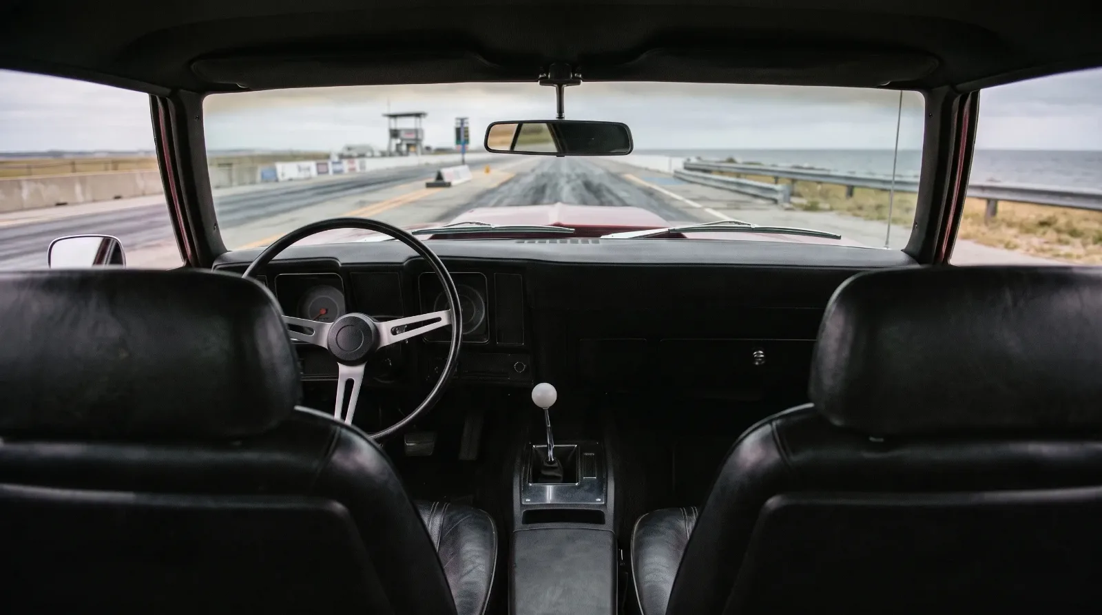 1969 Chevrolet Camaro SS 427 conversion, cockpit view toward a seaside drag strip