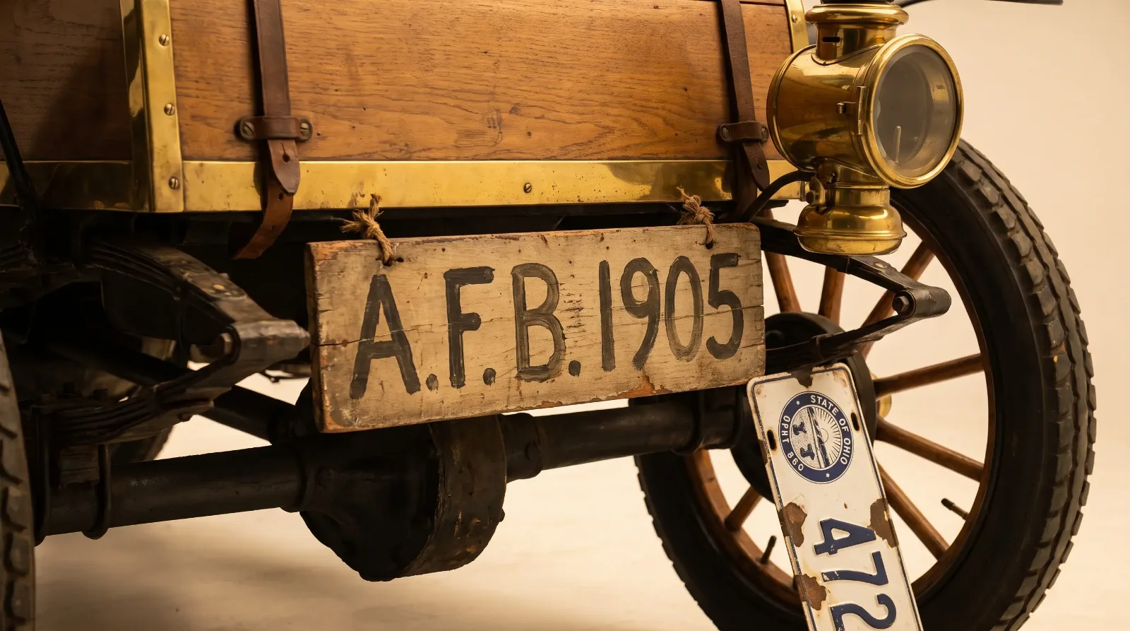 Hand-painted homemade registration plate on brass-era car