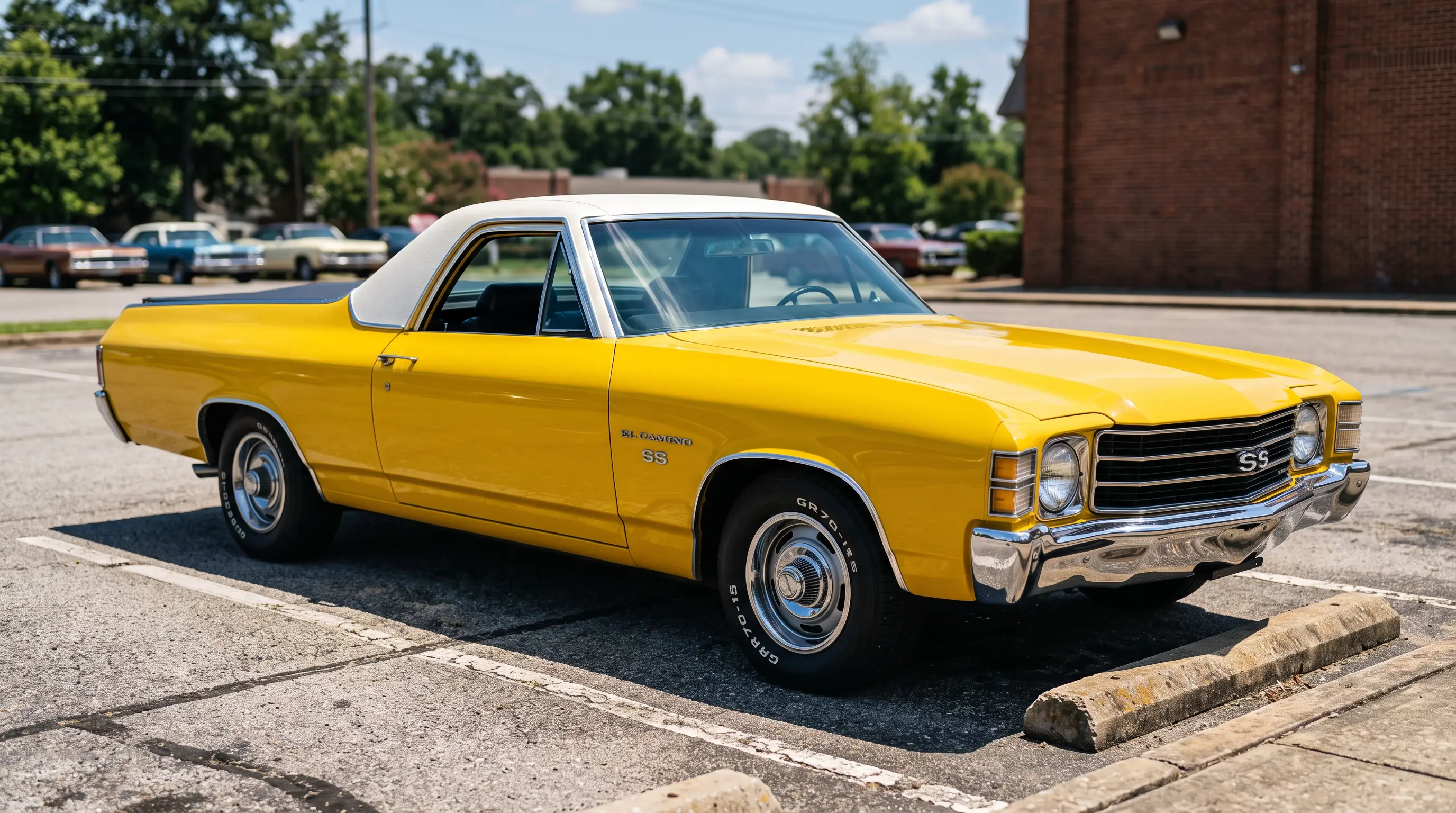 Yellow 1972 El Camino with white vinyl half top in sunlit parking lot