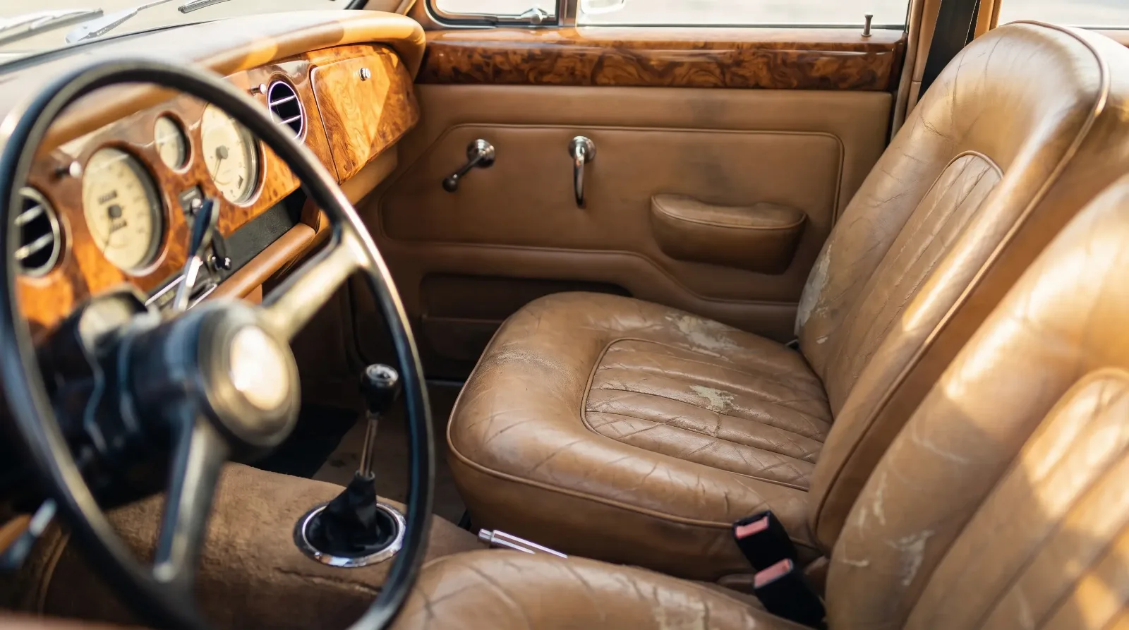 Aged leather and burl wood classic luxury car interior