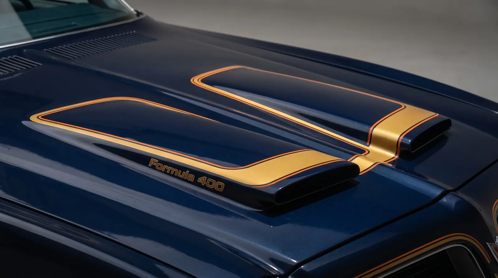 Close-up of a 1976 Pontiac Firebird Formula twin-scoop hood with factory W50 stripe decal