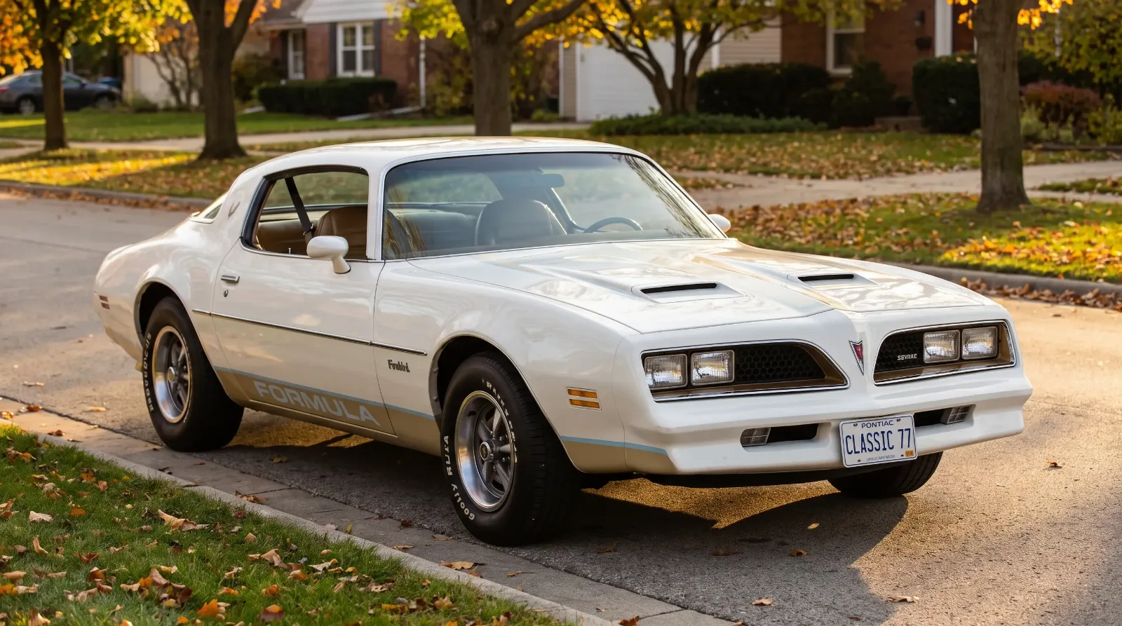 1977 Pontiac Firebird Formula in Cameo White parked on a suburban road at golden hour