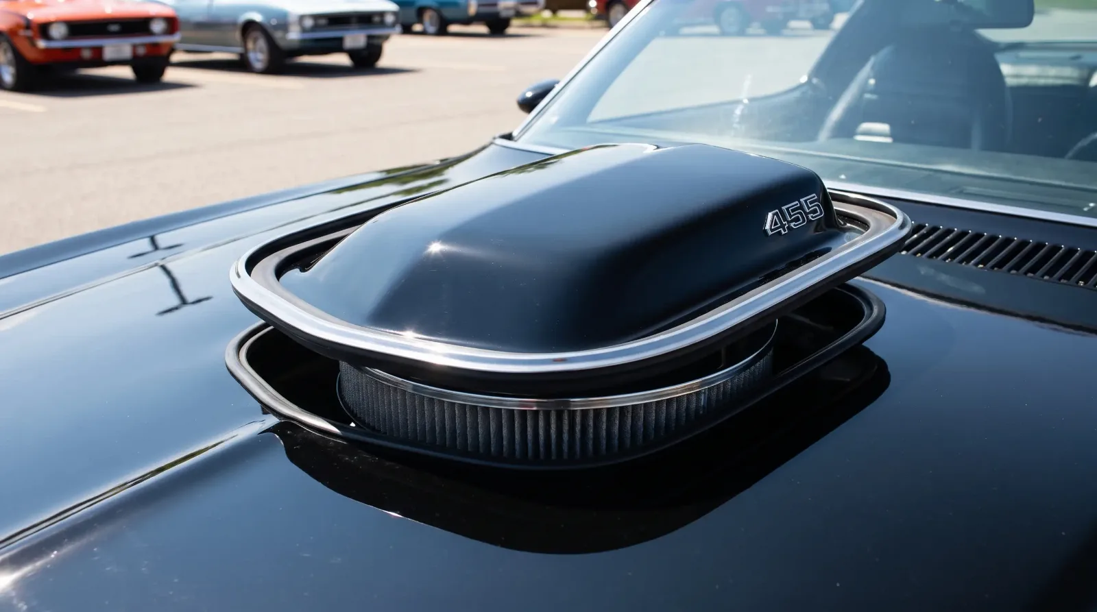 Close-up of a Pontiac Trans Am shaker hood scoop protruding through the hood