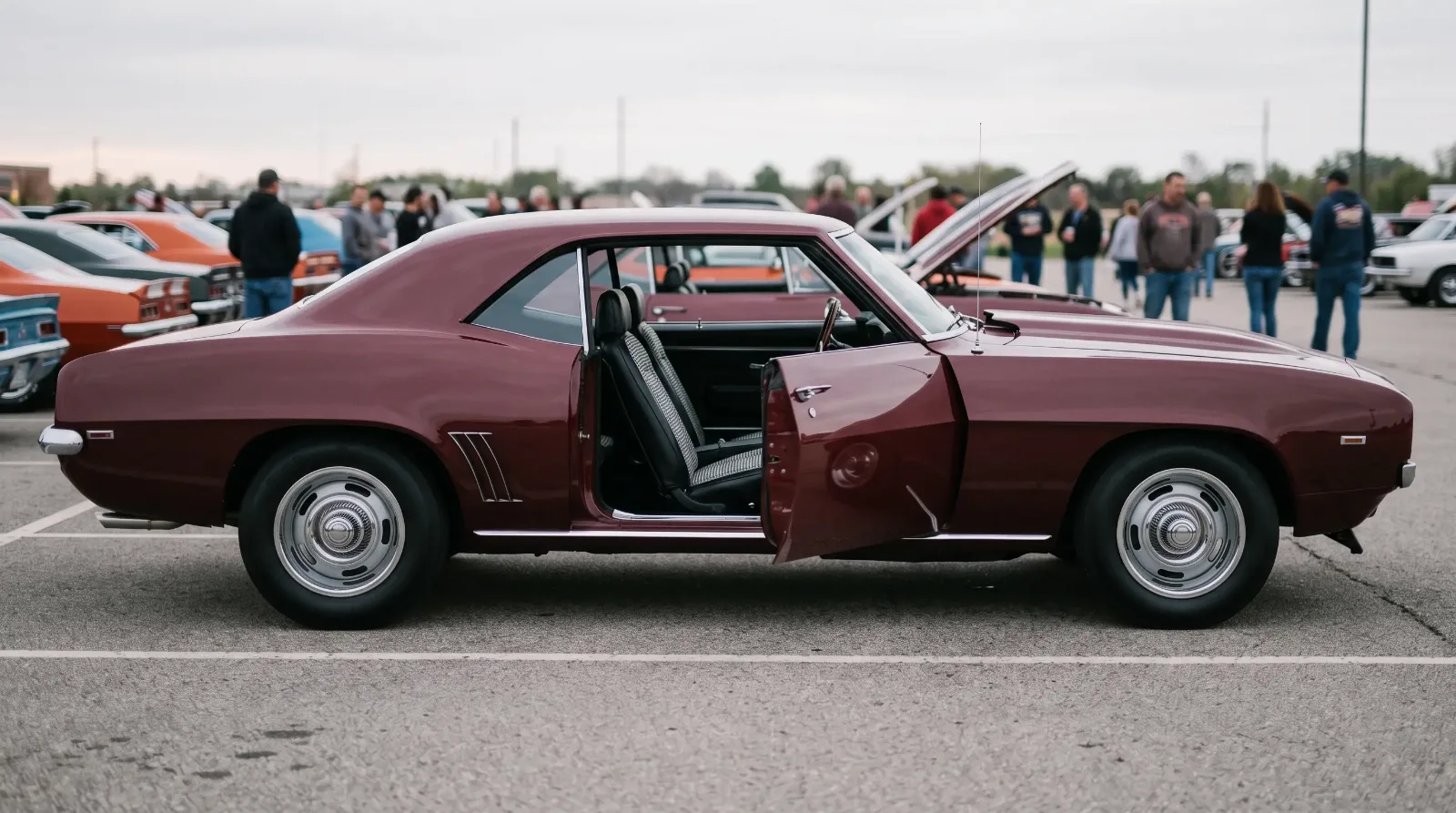 1969 Chevrolet Camaro, houndstooth buckets behind the open door
