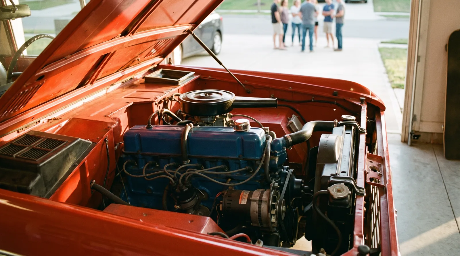1966 Ford Bronco 170 six, engine bay in an open home garage