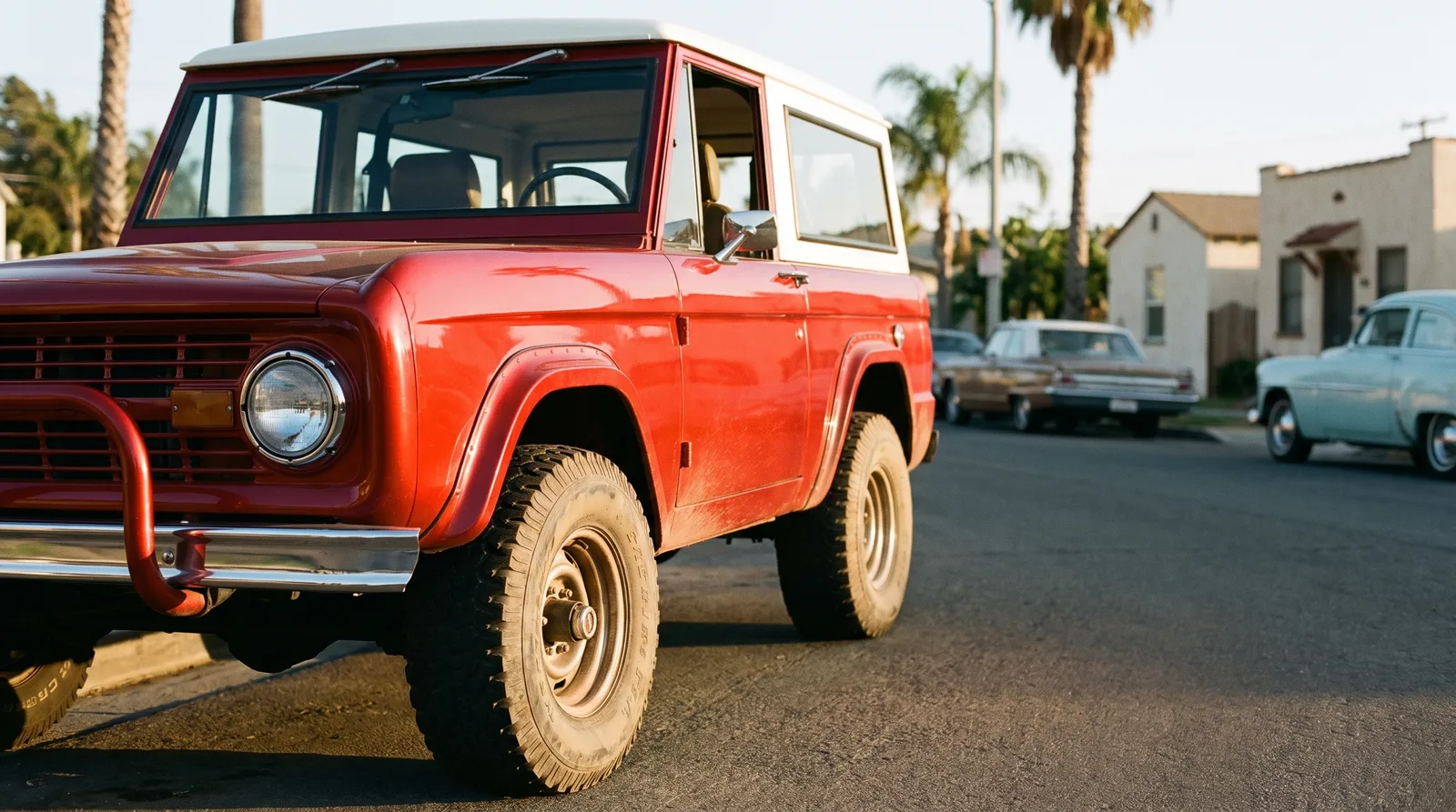 1970 Ford Bronco Baja, dusty front fender at golden hour