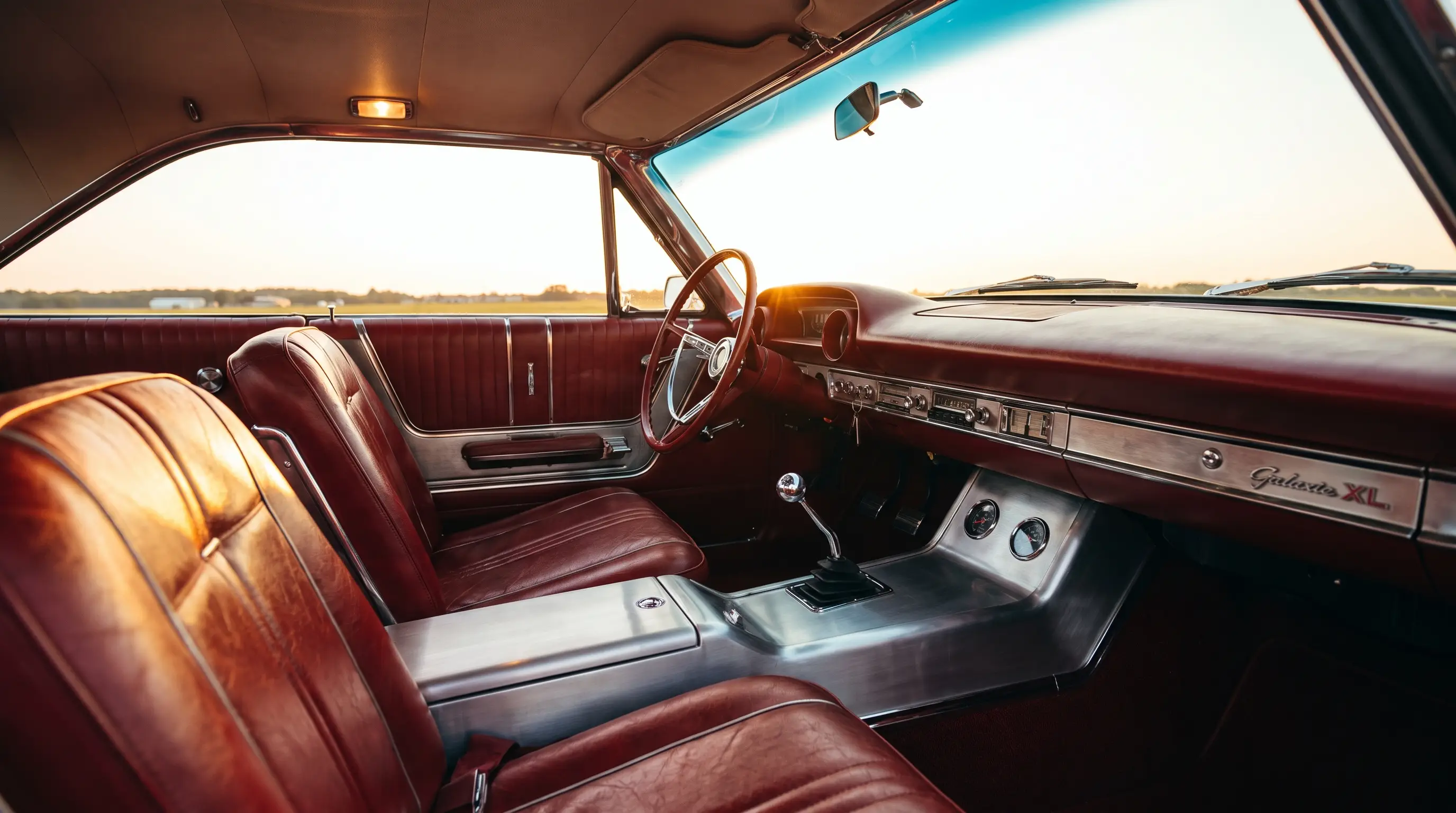Interior of a 1963 Ford Galaxie 500 XL with bucket seats and brushed aluminum console