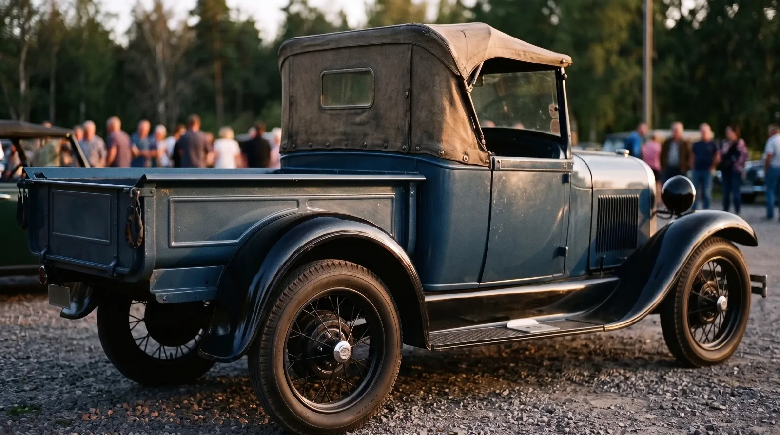 1928 Ford Model A open cab pickup, parked at a dusk car gathering