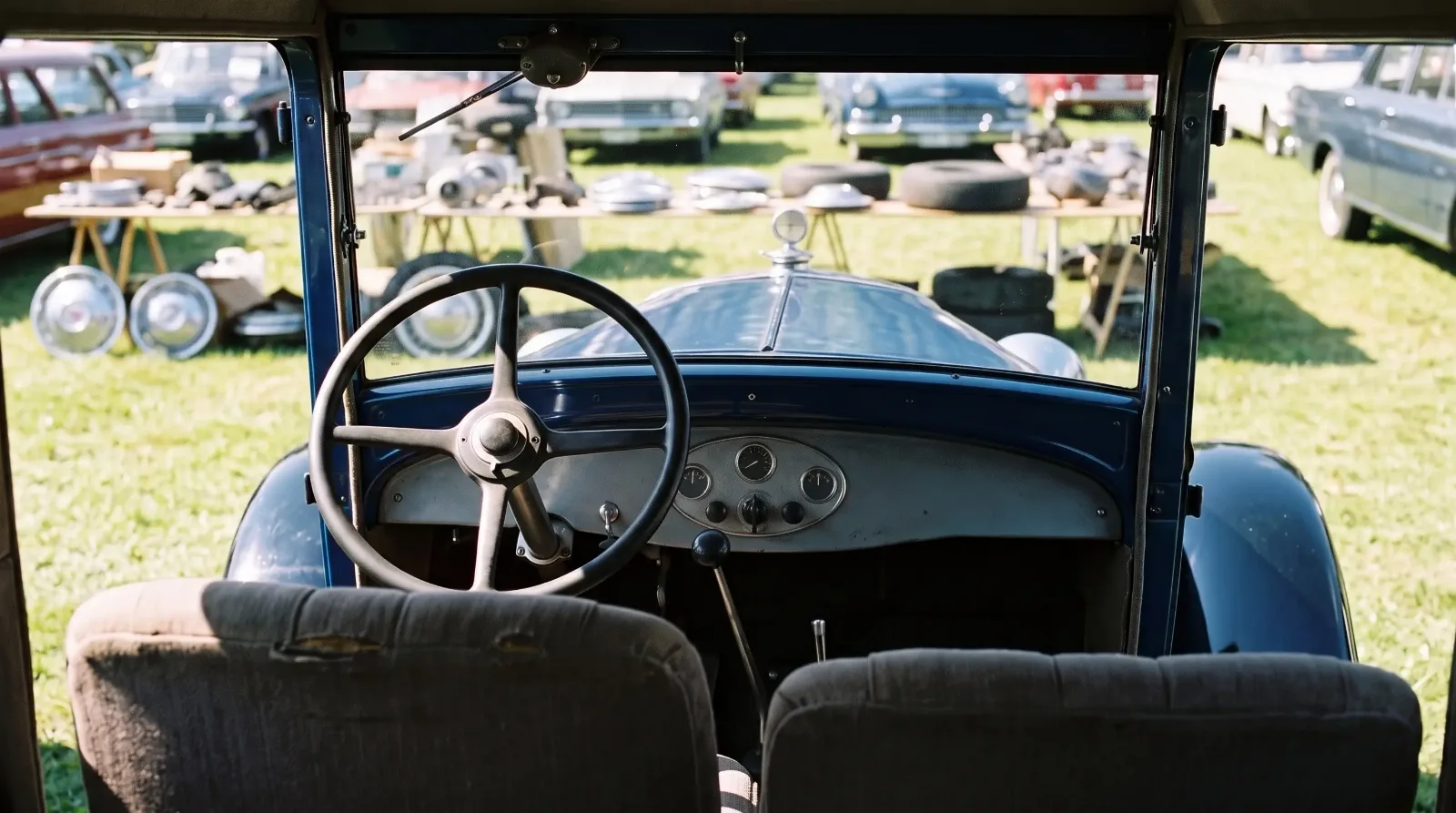 1929 Chevrolet six coach, driver view over the hood at a swap meet