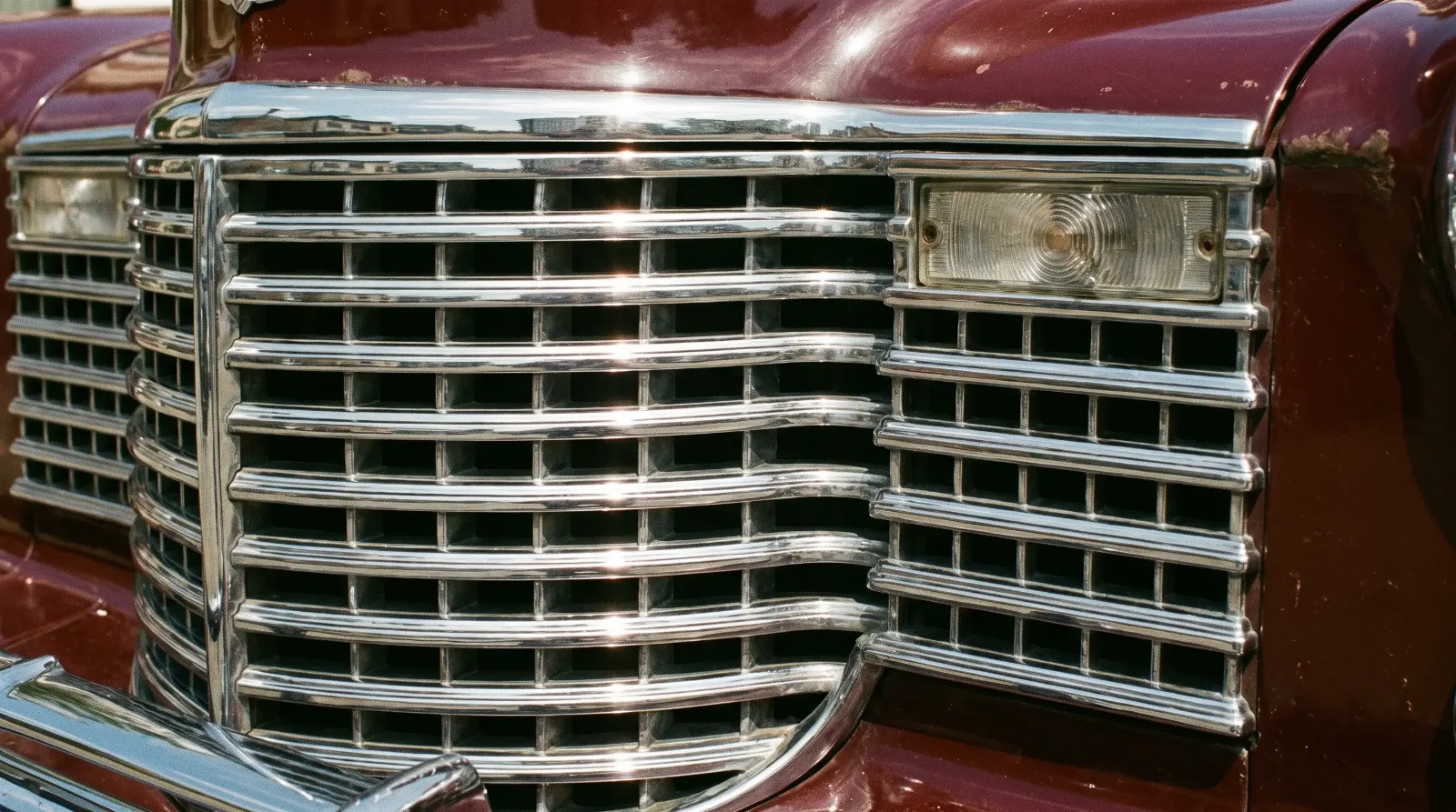 Chrome egg-crate grille detail on a 1940s Cadillac