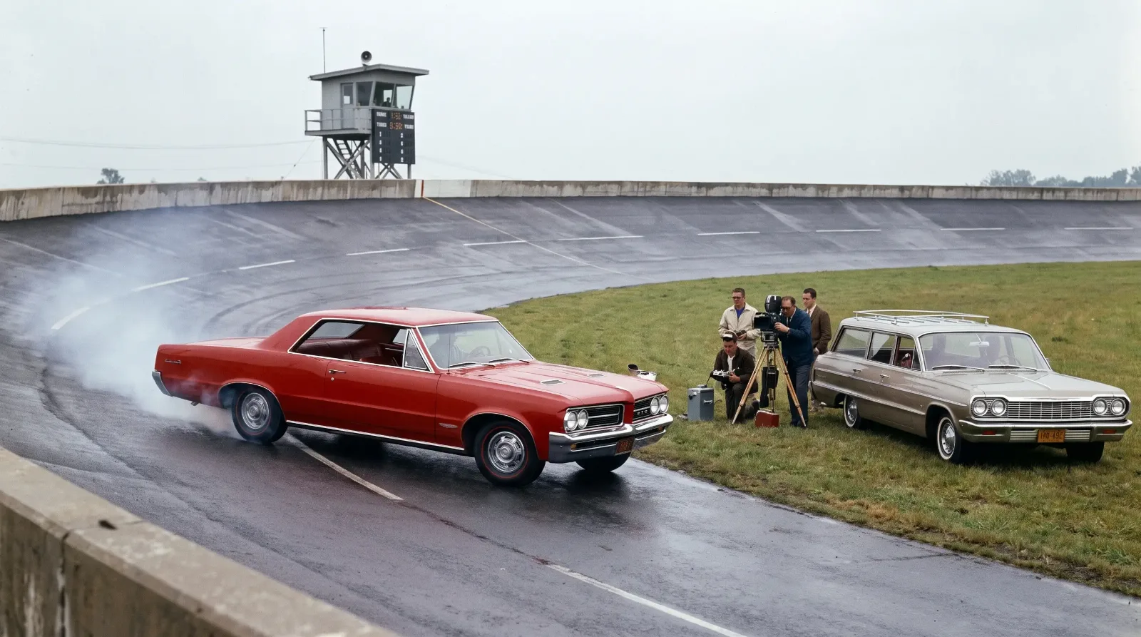 Red 1964 GTO on a period magazine test track