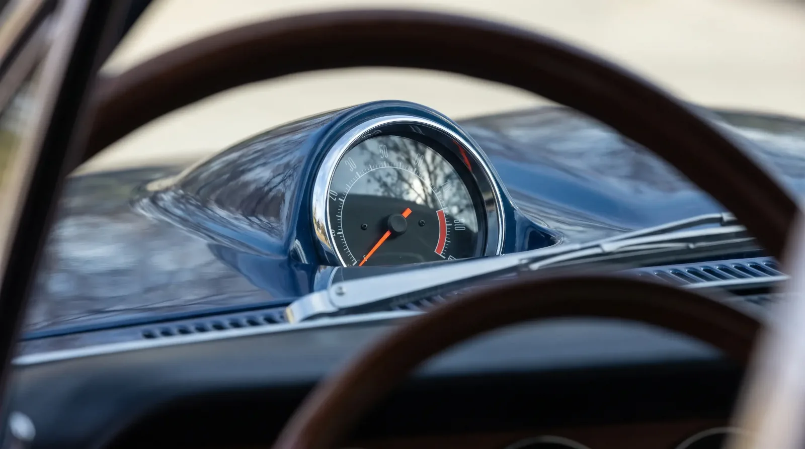 1967 GTO hood-mounted tachometer gauge close-up