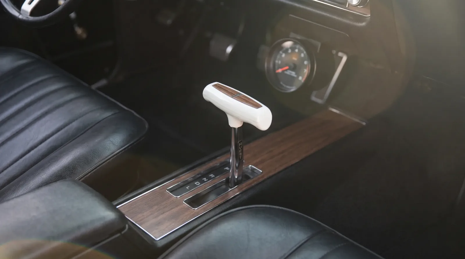 1969 GTO Judge console with white Hurst T-handle shifter
