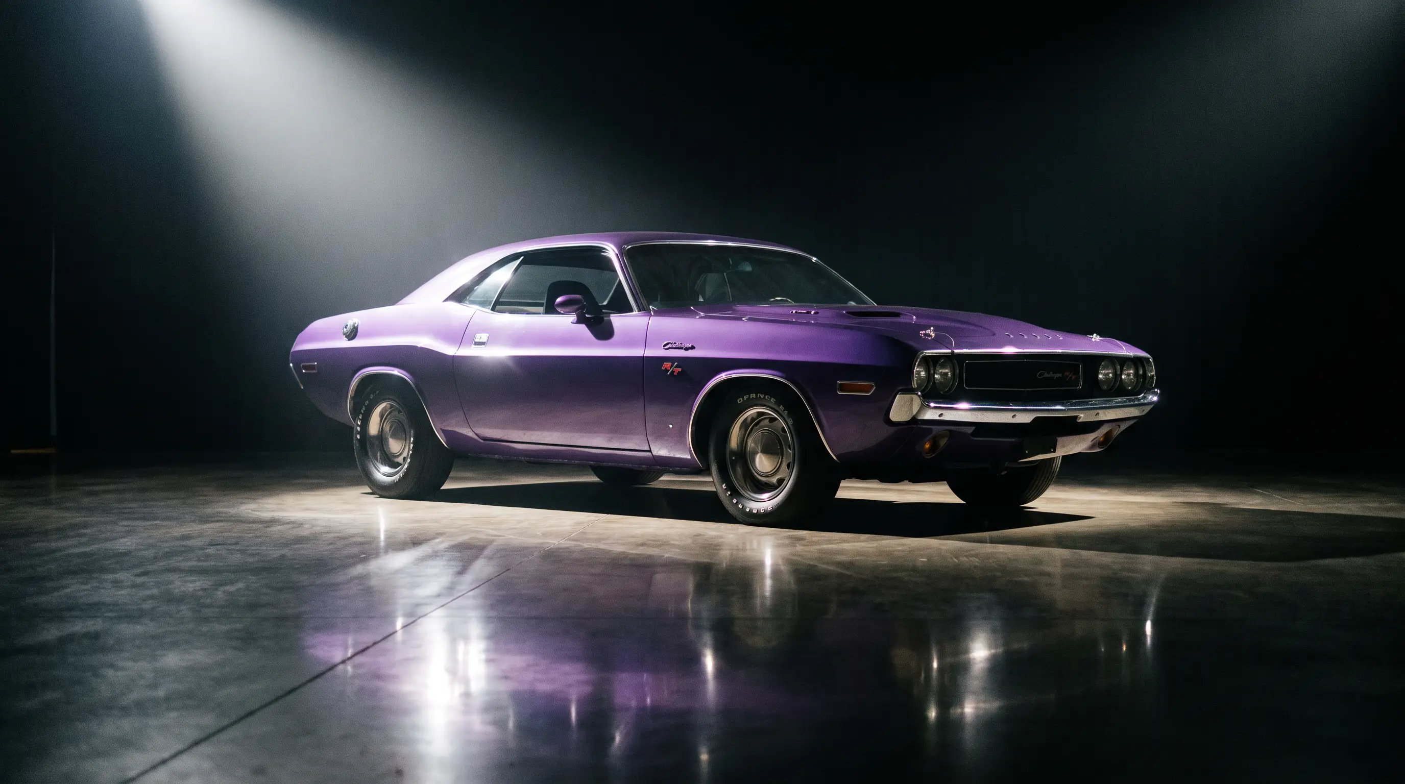 Purple 1970 Dodge Challenger Hemi spotlighted on an auction stage
