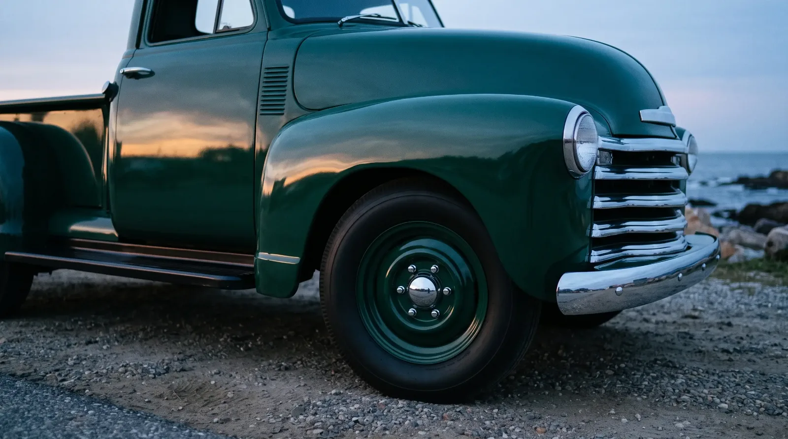 Front fender detail at dusk on the coast with a 1953 Chevrolet 3100 pickup